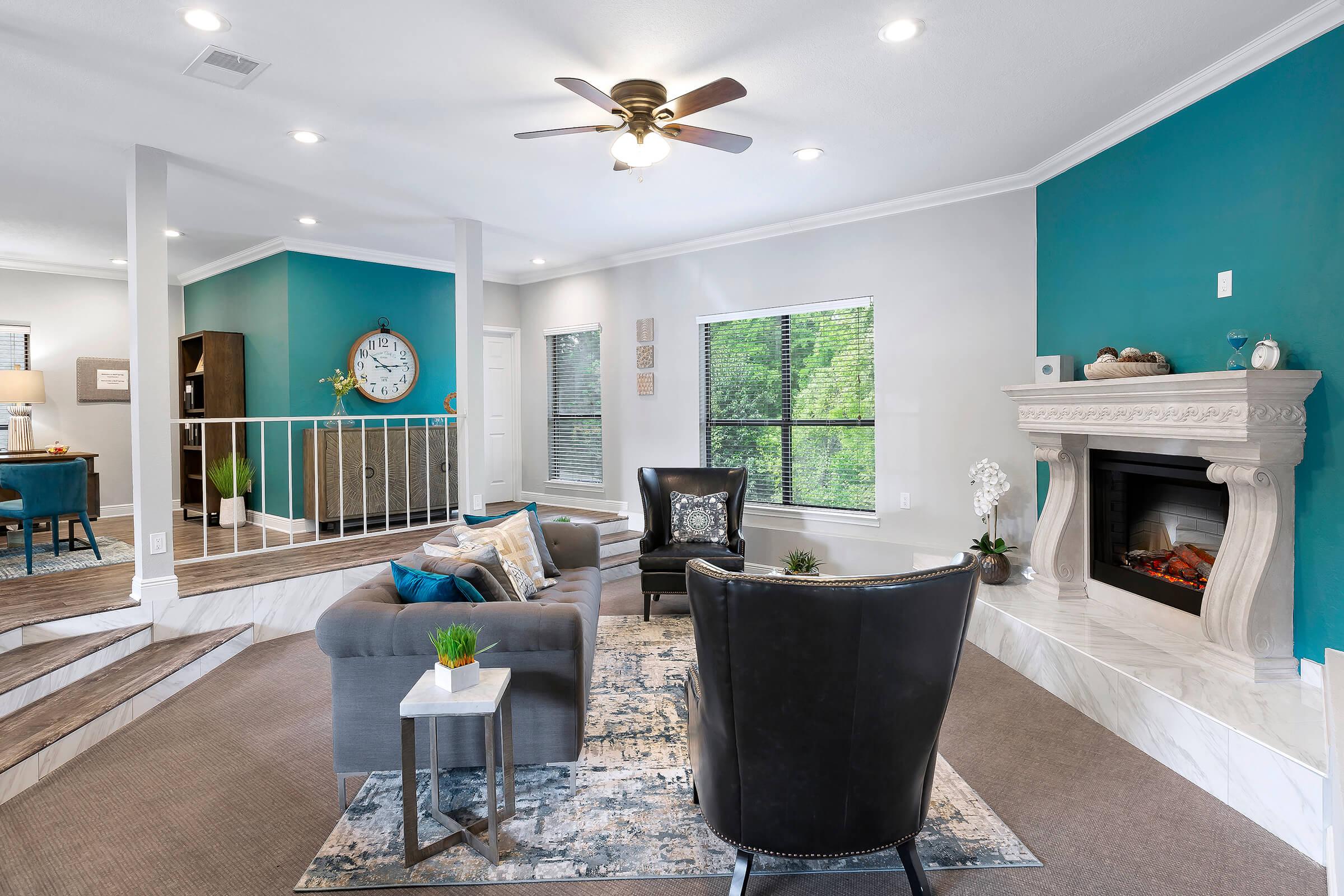 a living room filled with furniture and a fire place