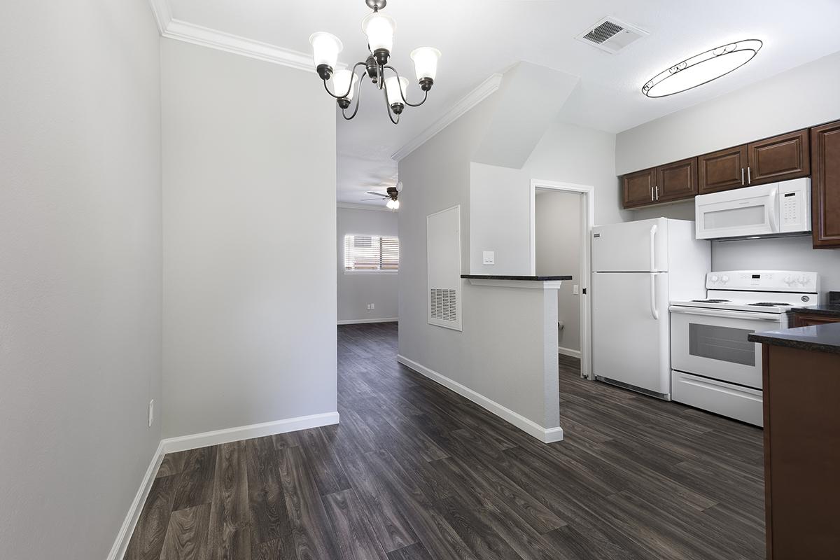 a kitchen with a wood floor