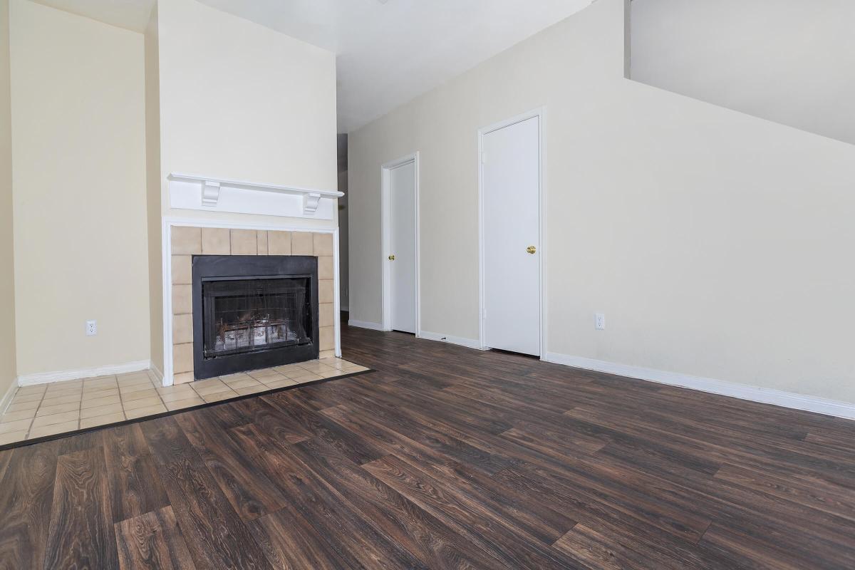 a large empty room with a wooden floor