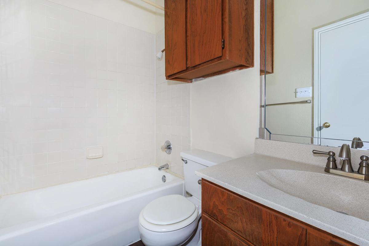 a white sink in a small room