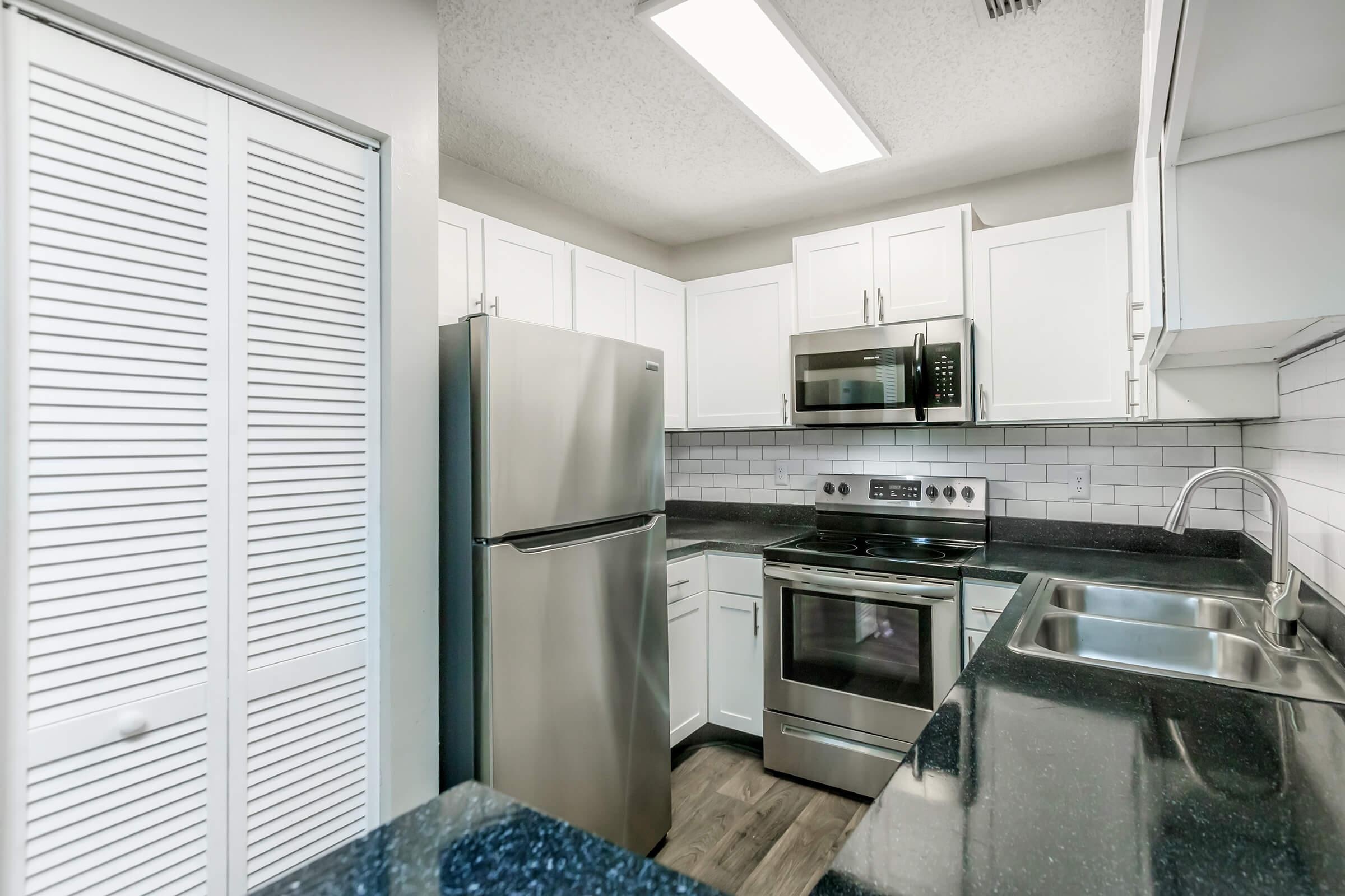 a kitchen with a sink and a window