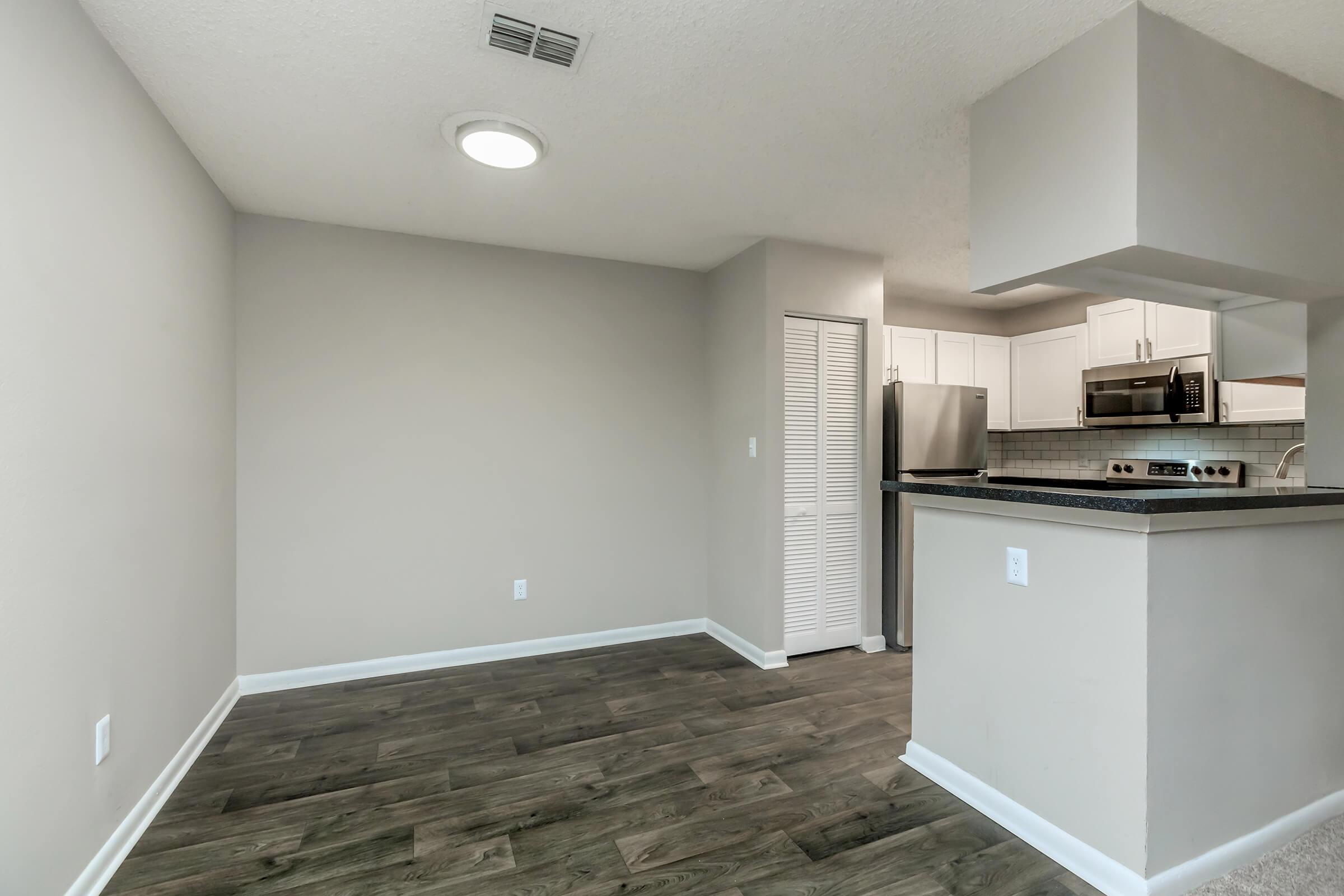 a kitchen with a sink and a refrigerator