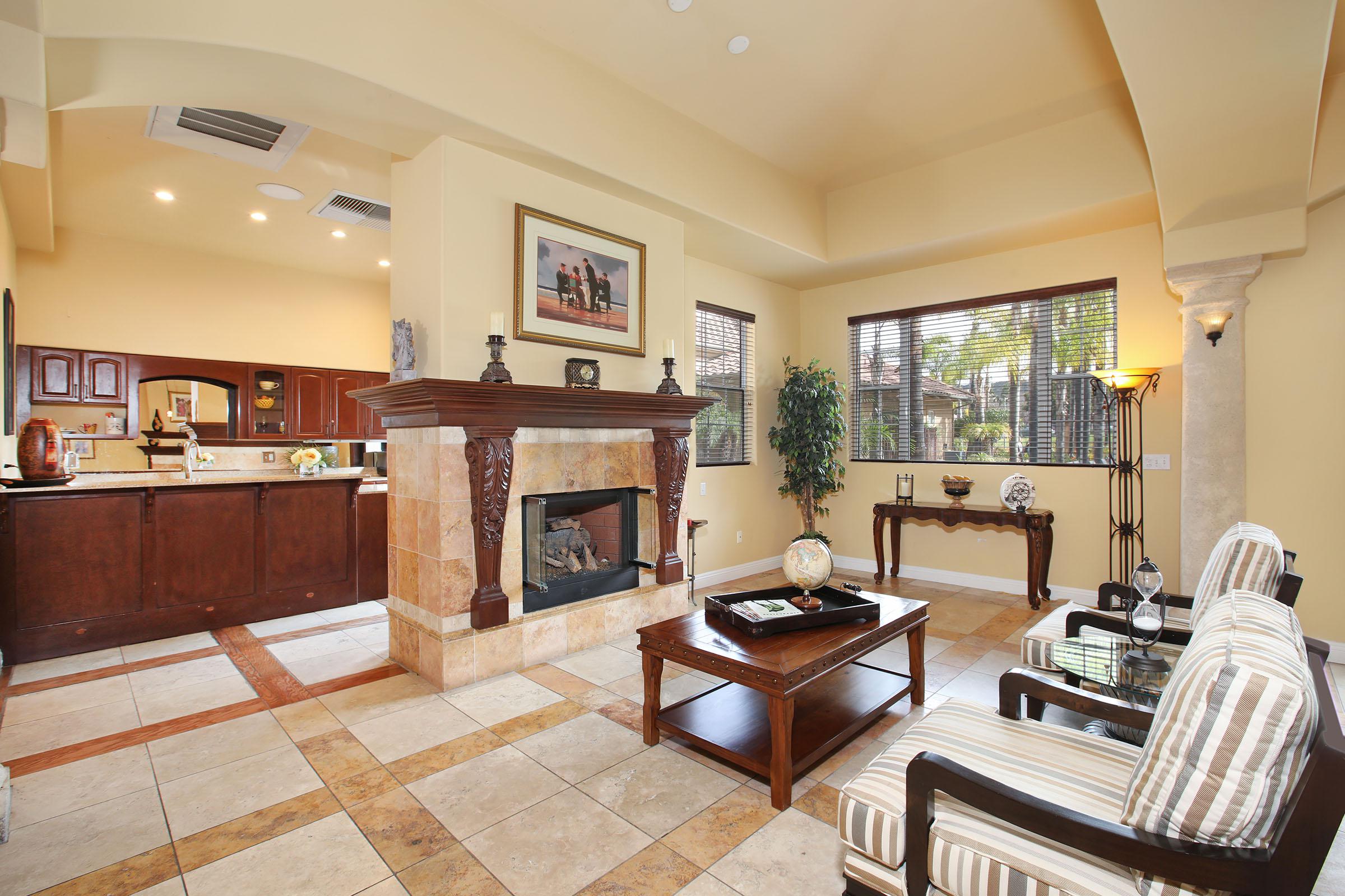 a living room filled with furniture and a fireplace