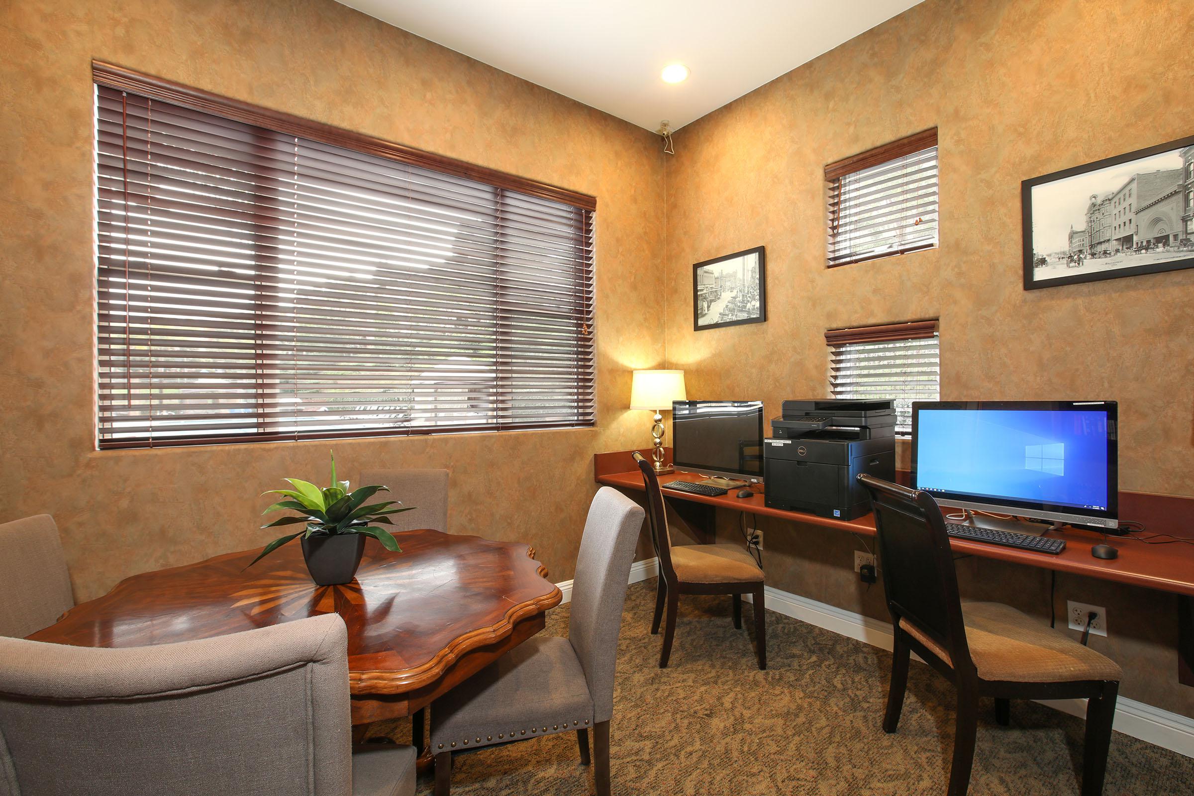 a living room filled with furniture and a flat screen tv