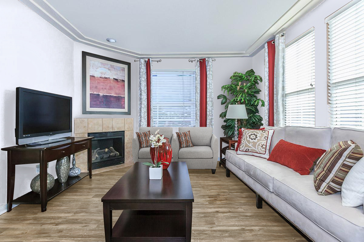 a living room filled with furniture and a flat screen tv