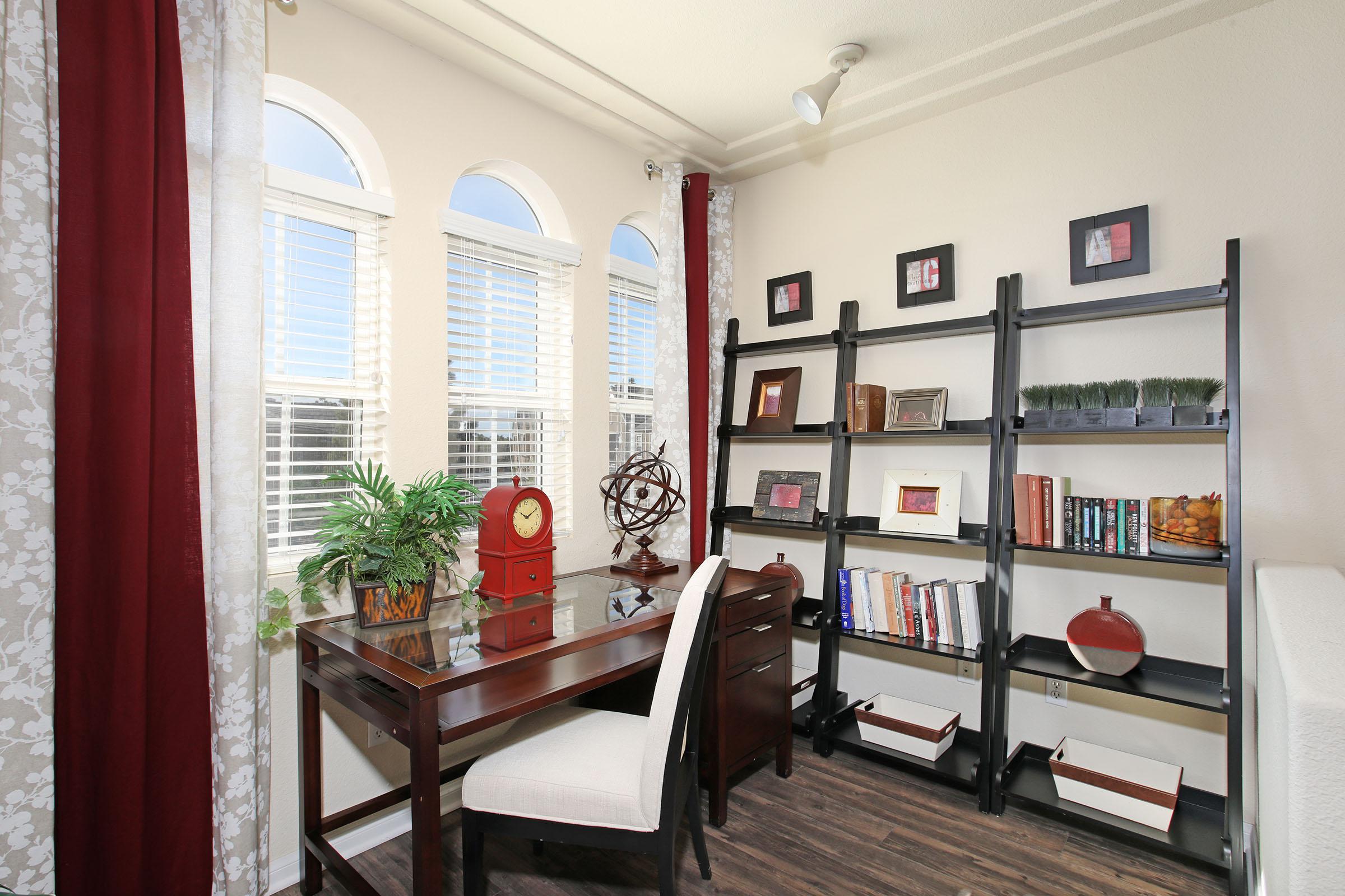 a room filled with furniture and a large window