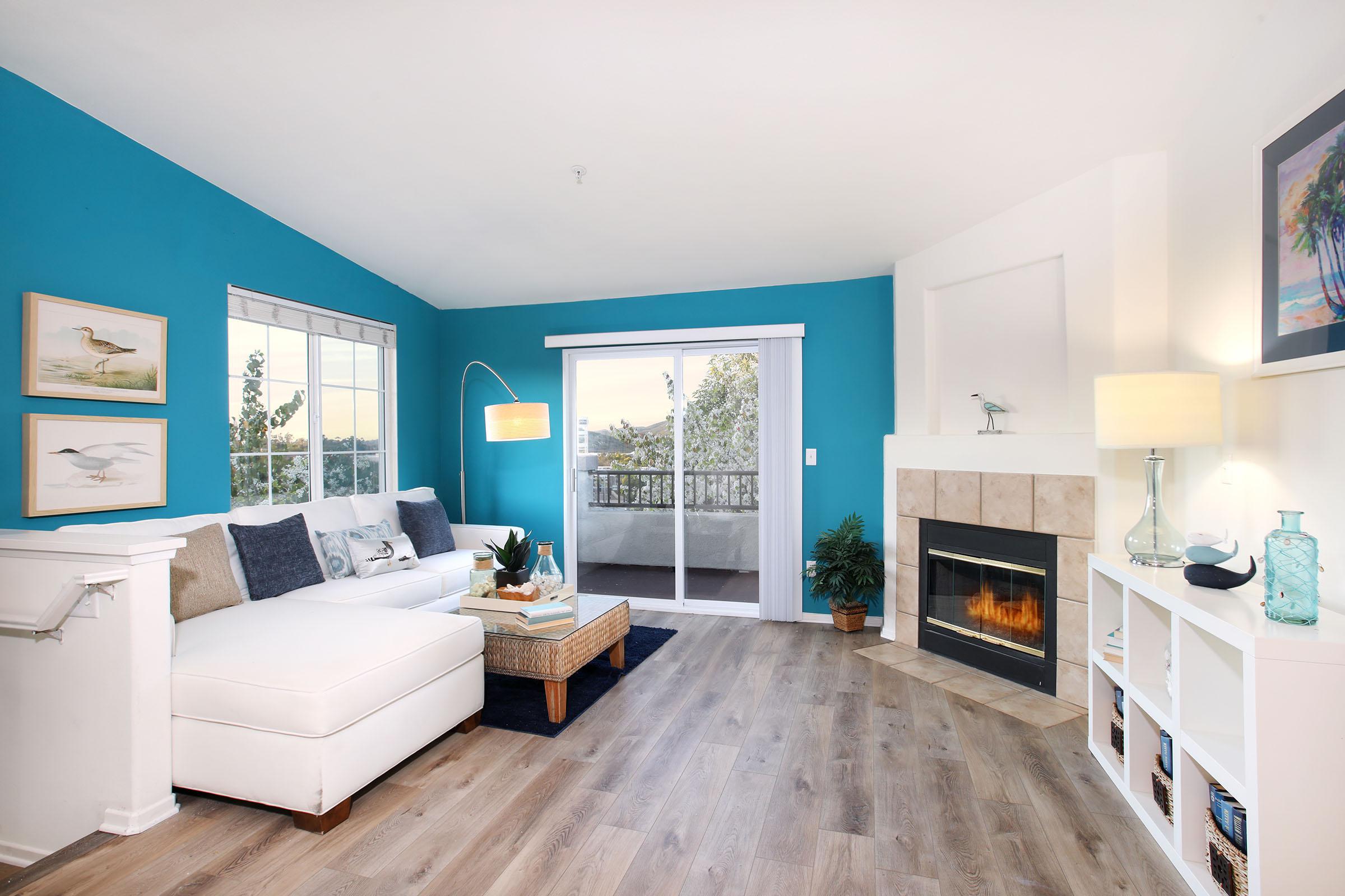 a living room filled with furniture and a fireplace