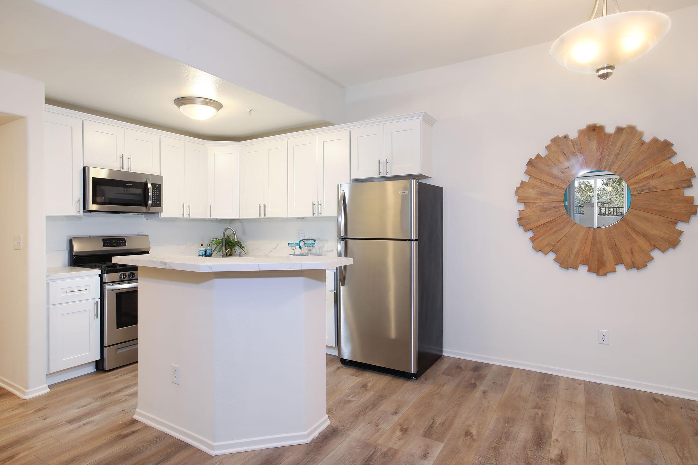 a kitchen with a wood floor