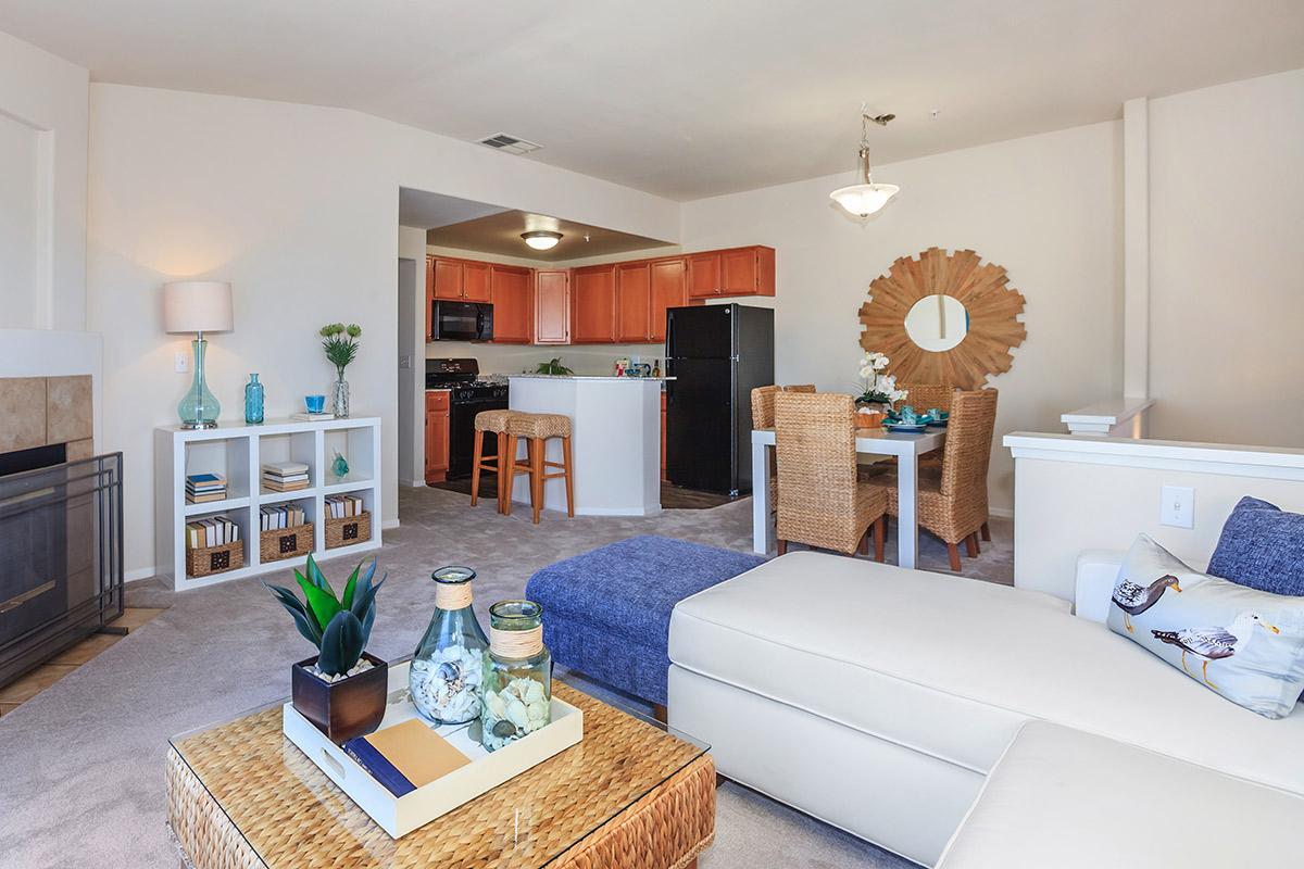 a living room filled with furniture and a flat screen tv