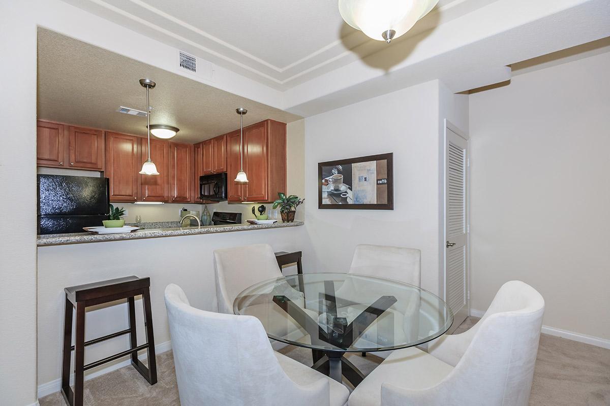 a living room filled with furniture and a table