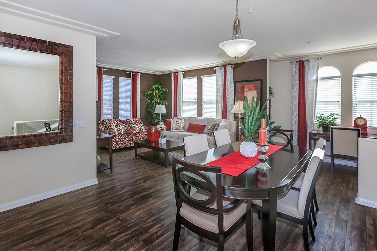 a living room filled with furniture and a large window