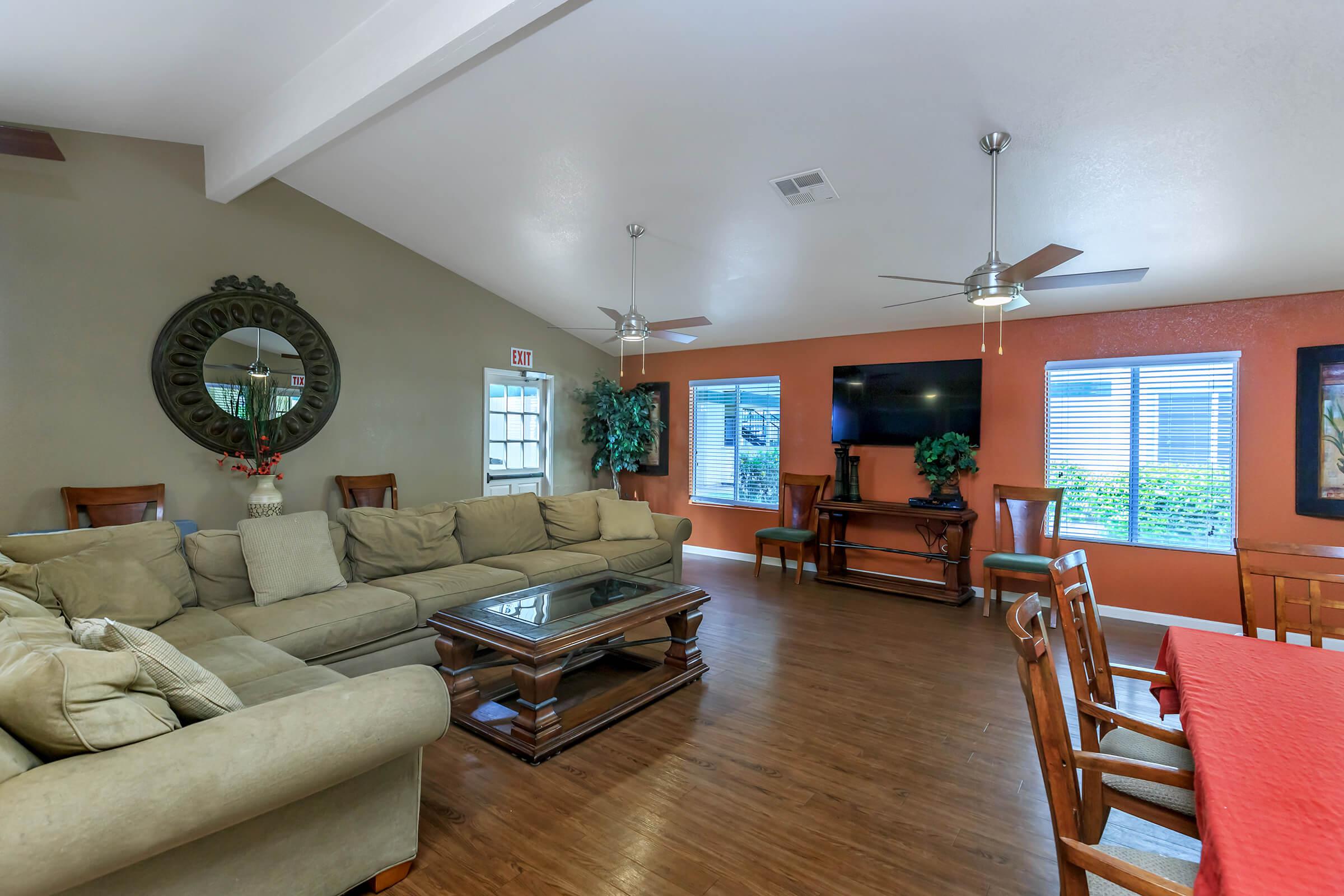 a living room filled with furniture and a fire place