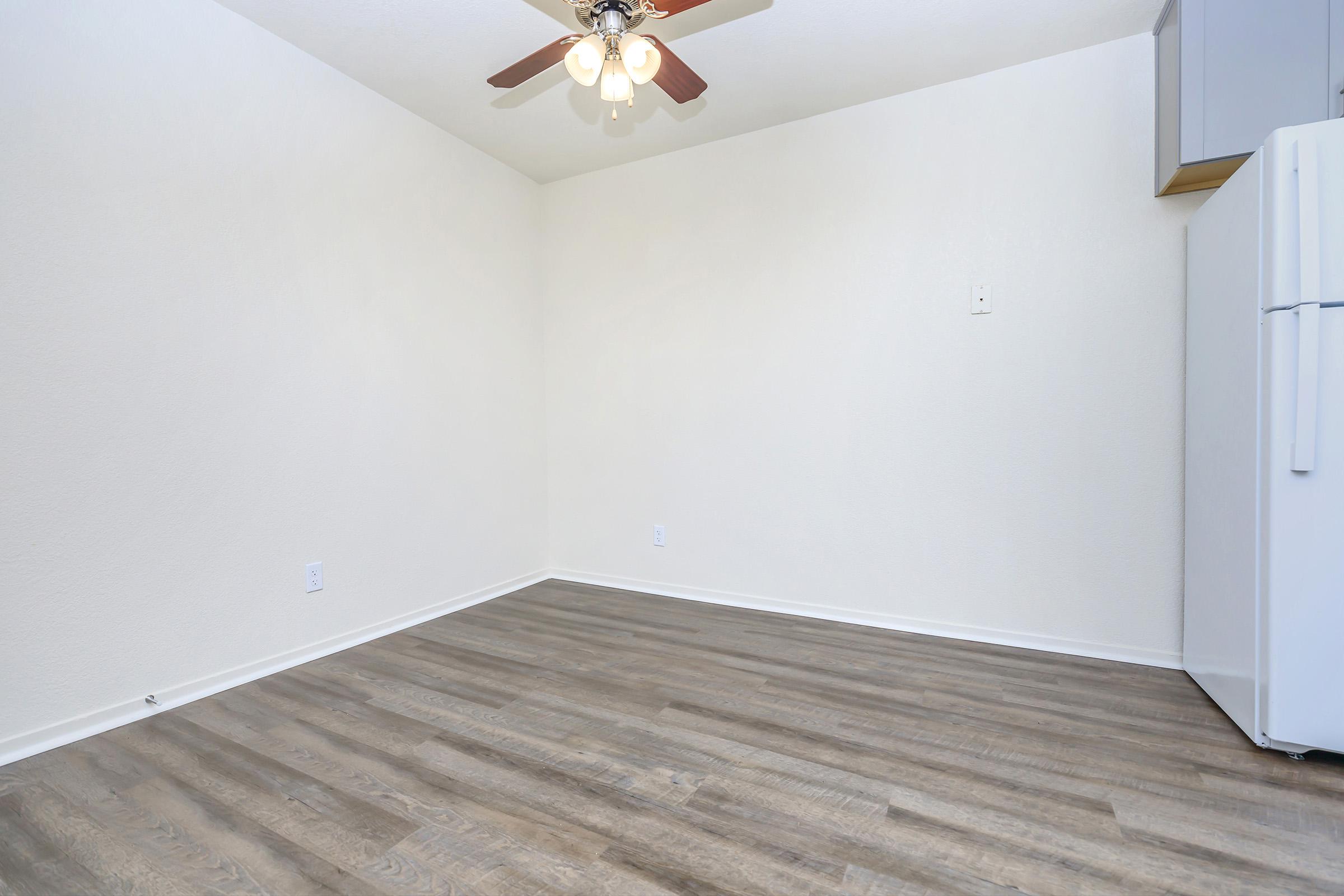 a kitchen with a wooden floor