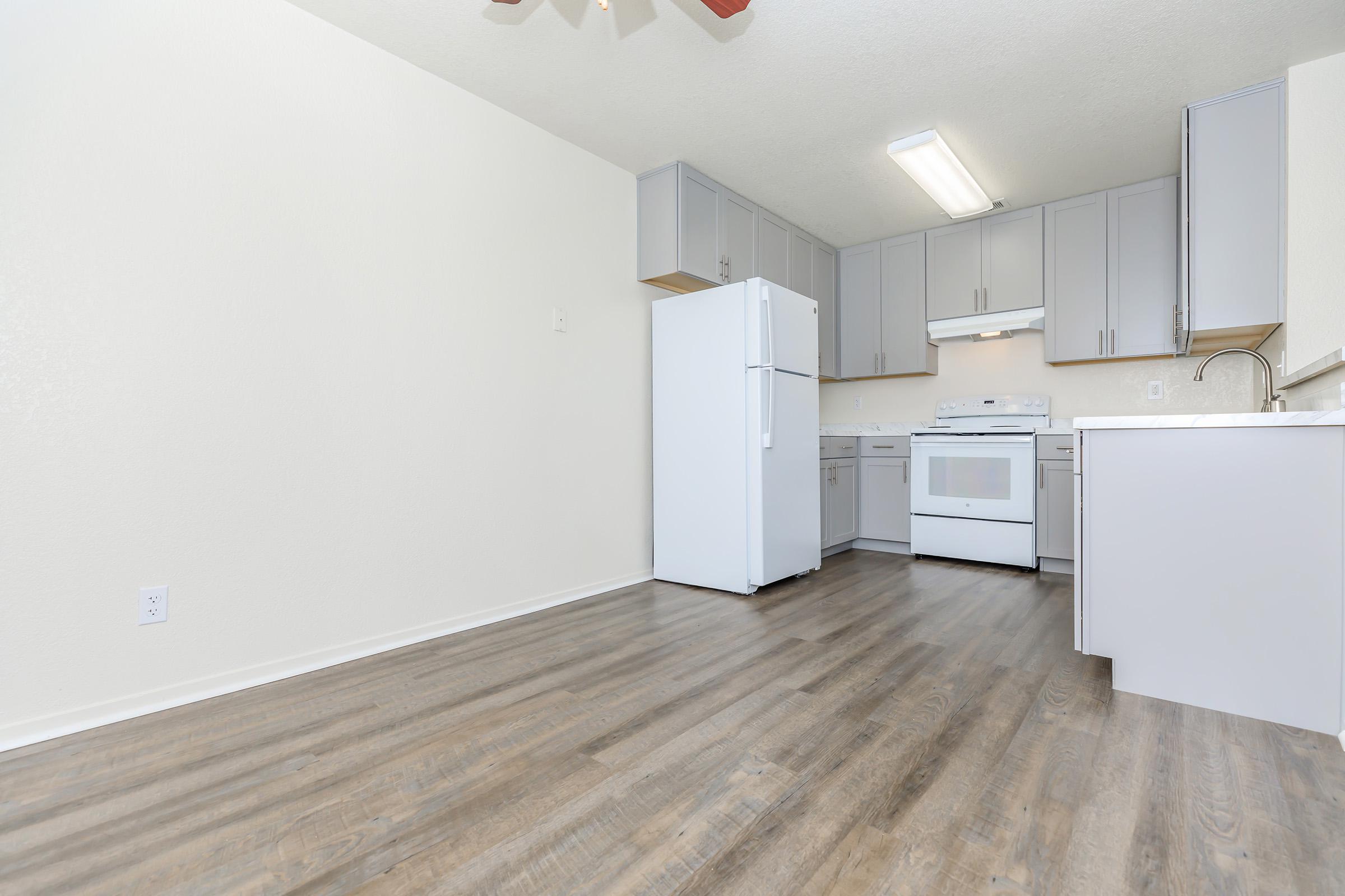 a kitchen with a wood floor