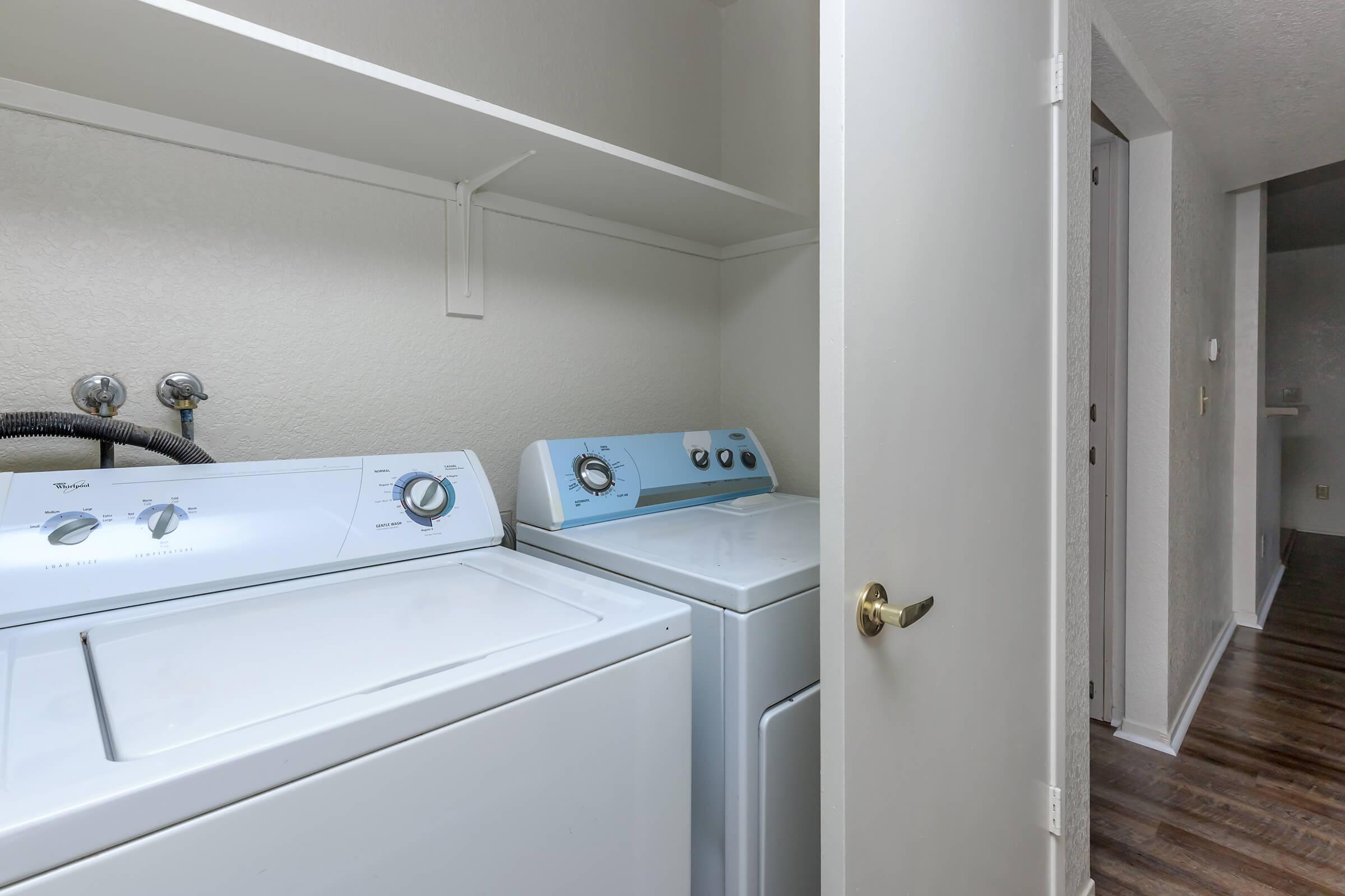 a white refrigerator freezer sitting in a room
