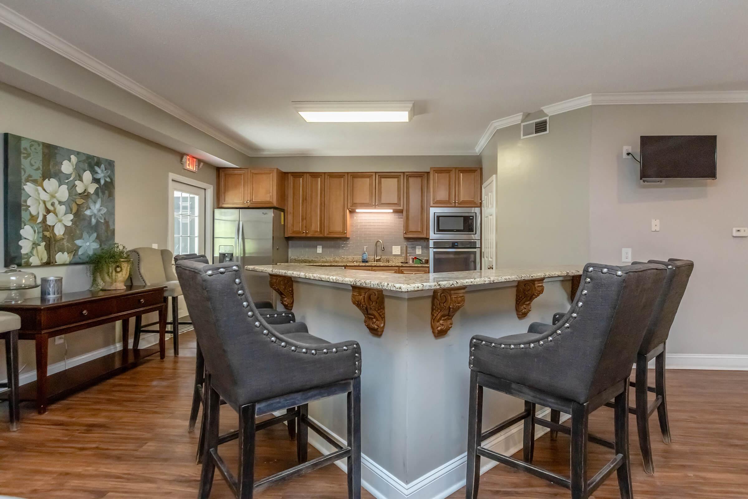 a living room filled with furniture and a table