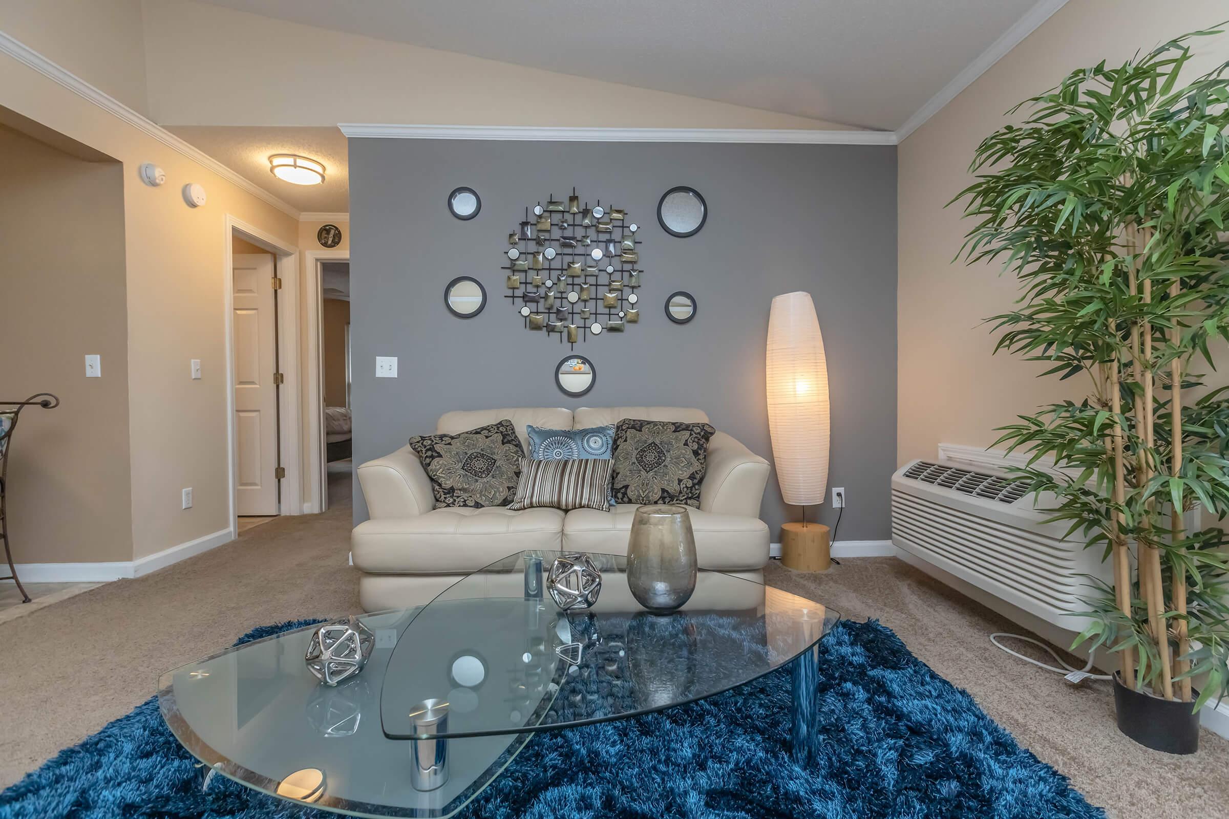 a living room filled with furniture and a flat screen tv