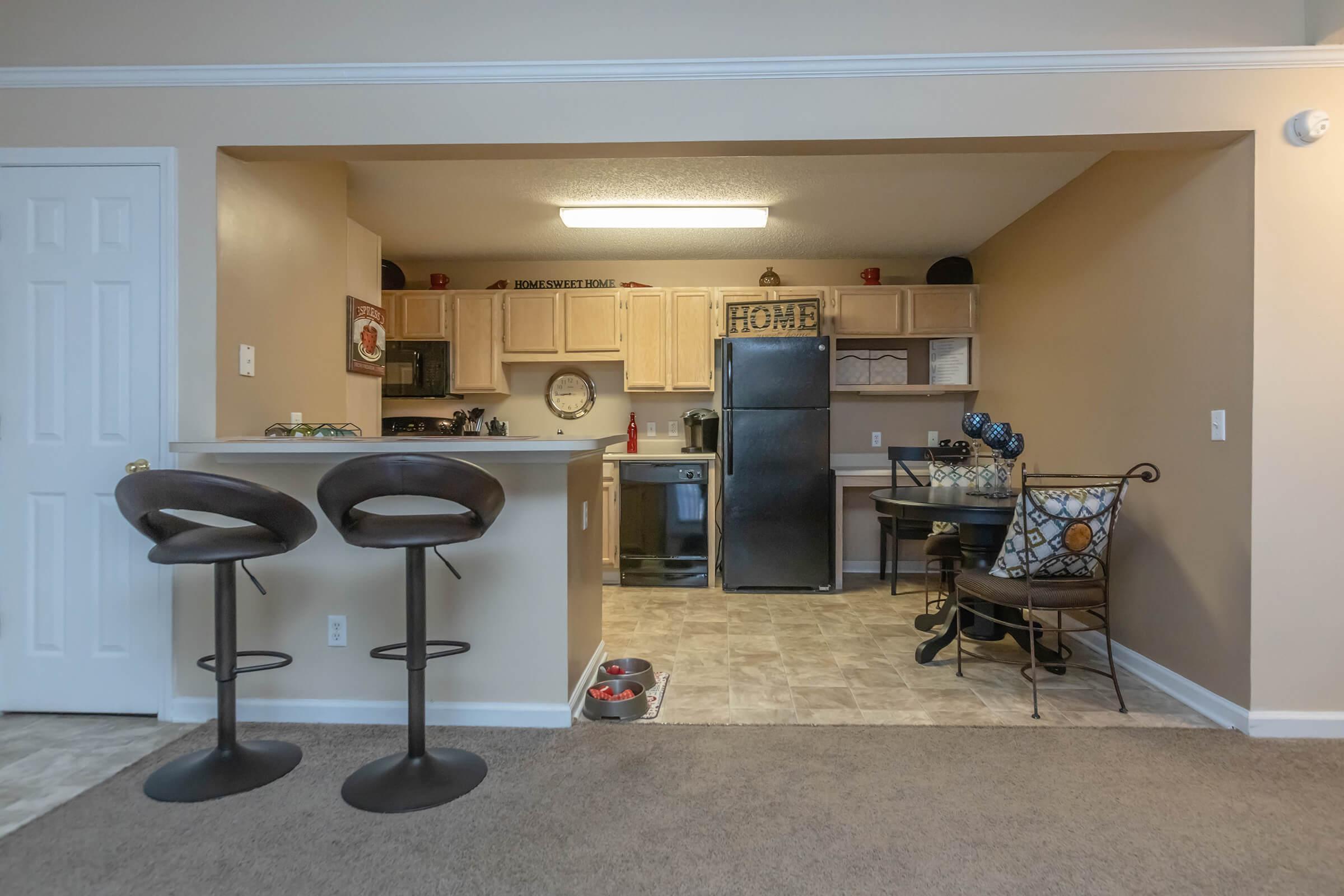 a living room filled with furniture and a tv