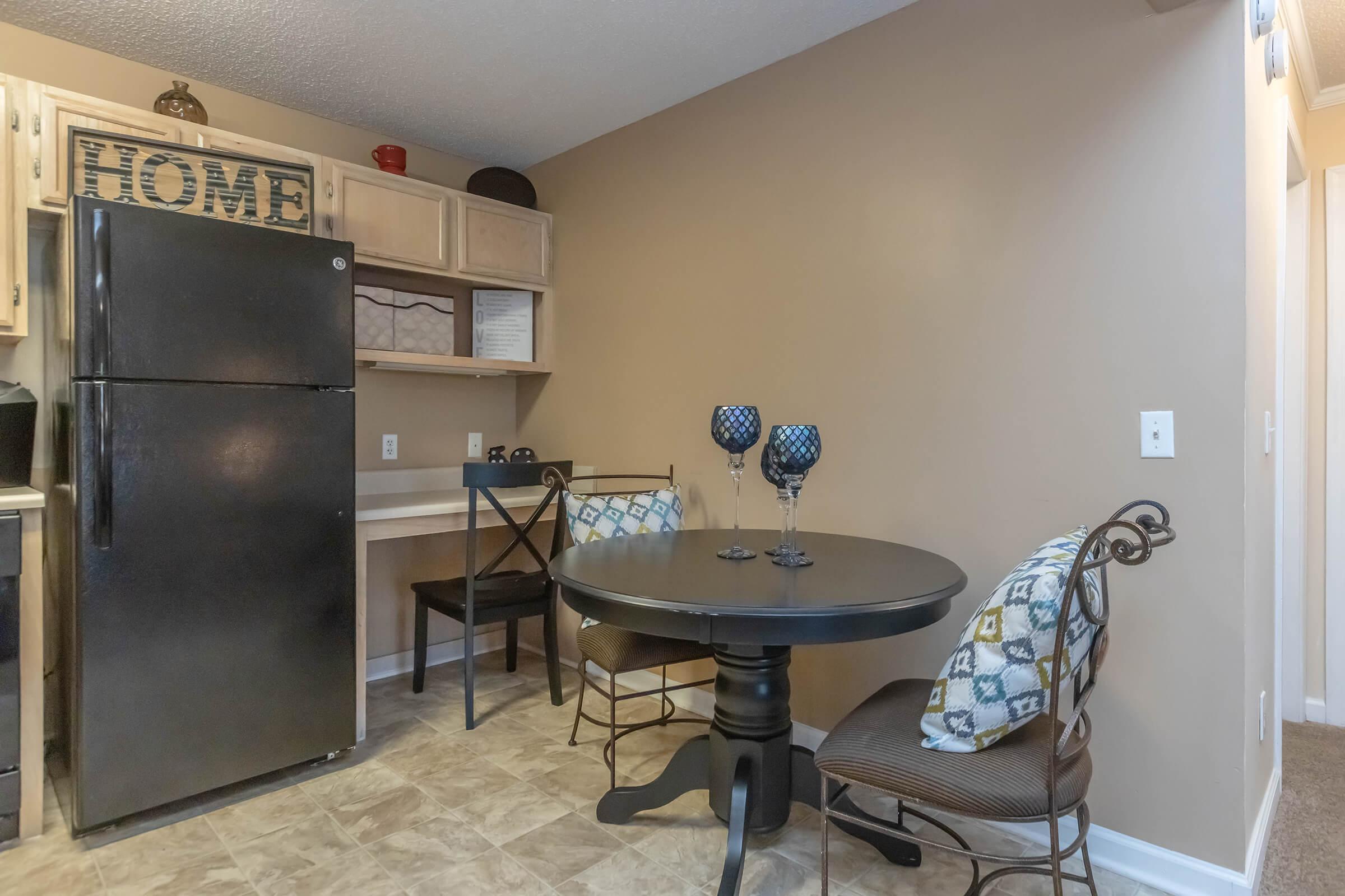 a stainless steel refrigerator in a room