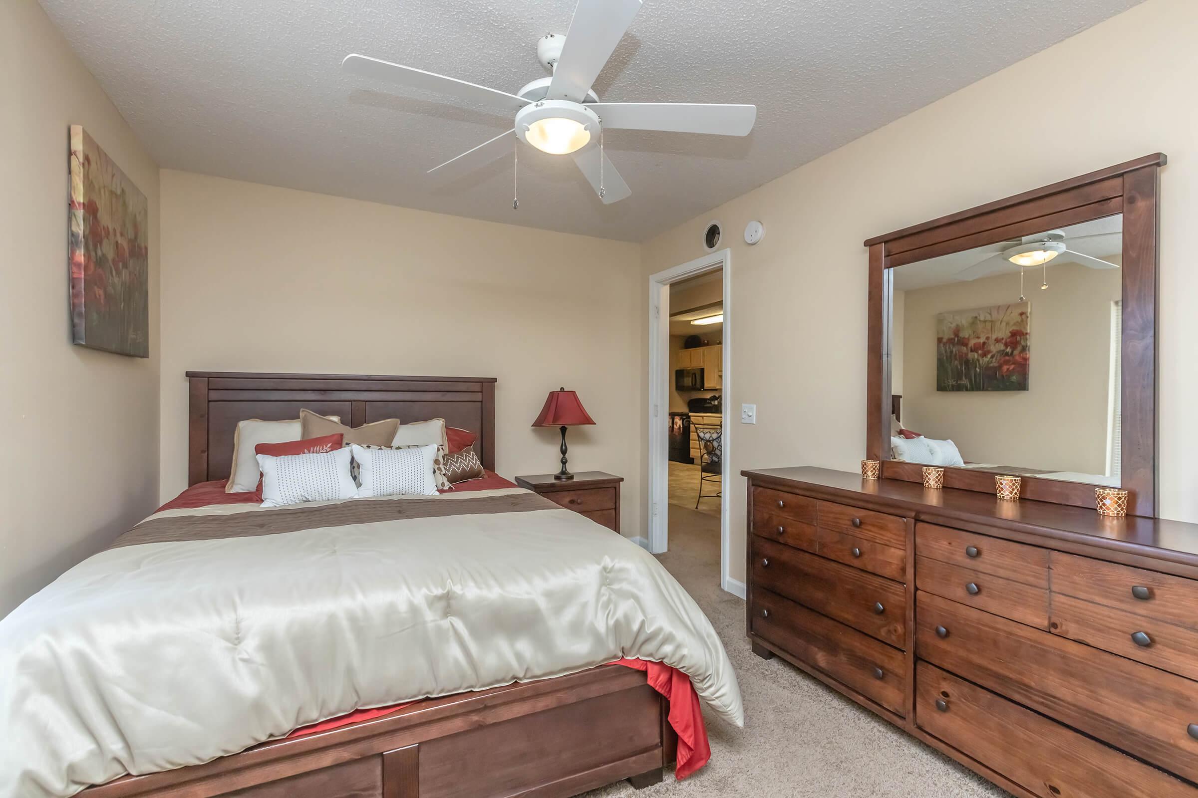 a bedroom with a large bed in a room