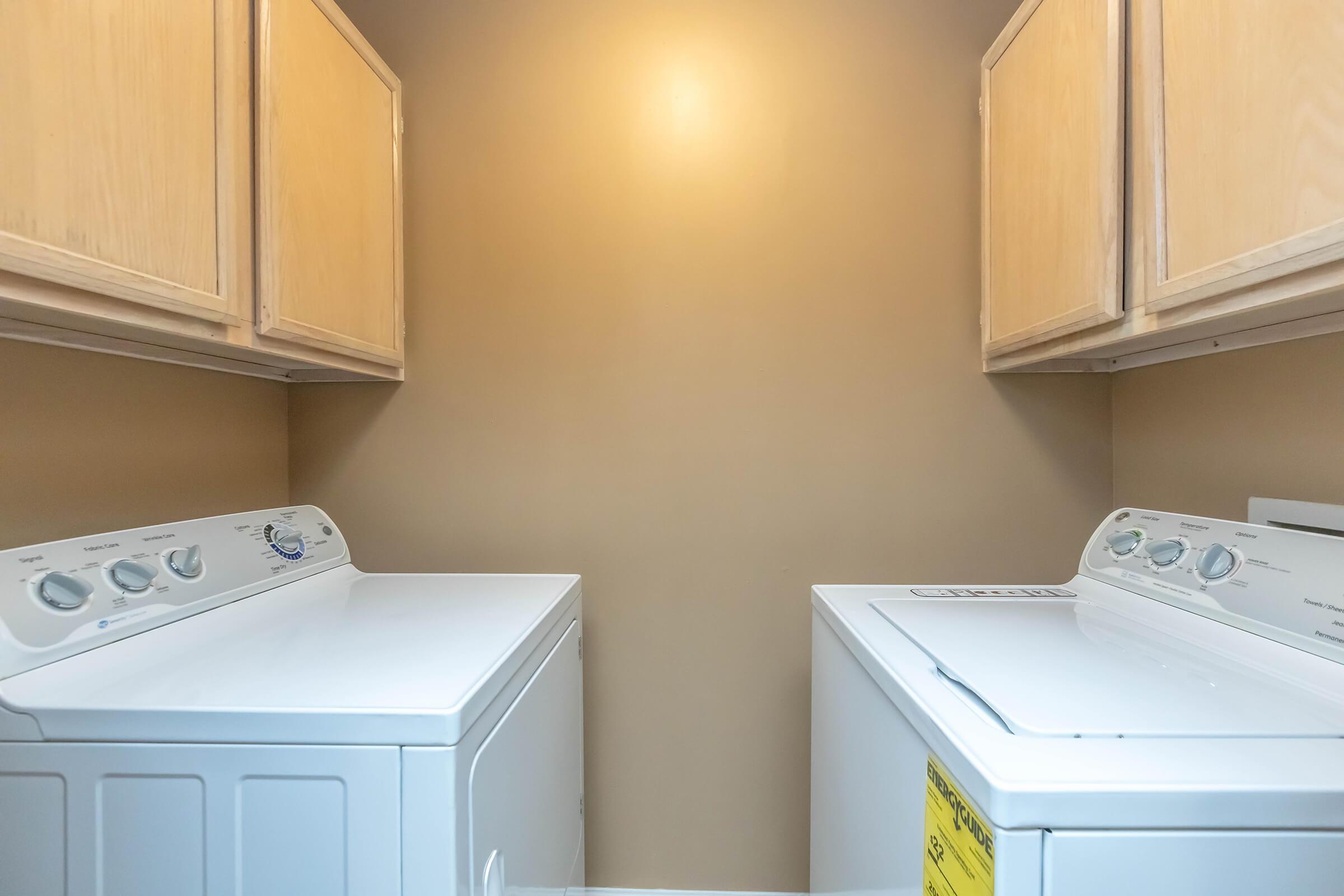 a kitchen with a sink and a mirror