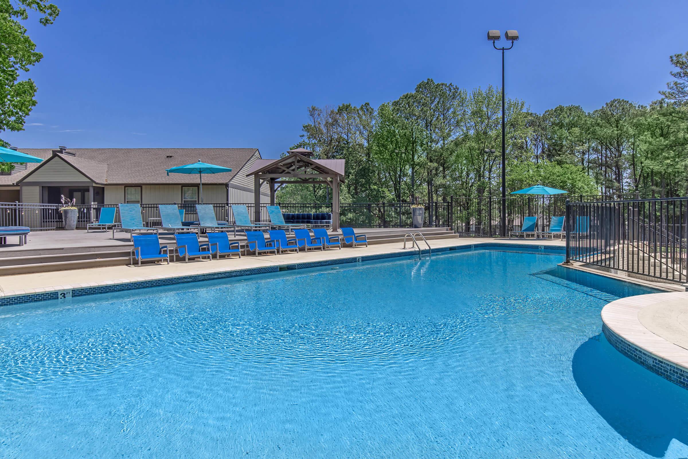 Soak up the sun at the sparkling swimming pool at Madison Landing at Research in Madison, AL