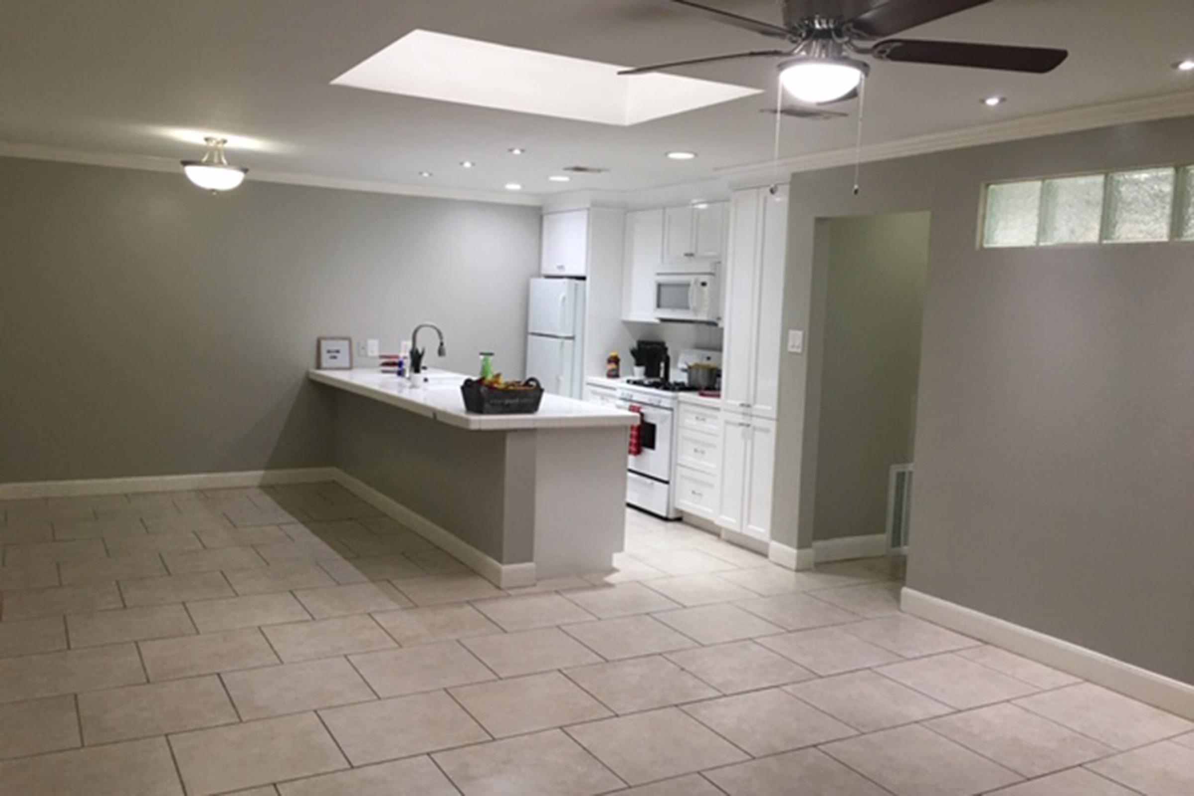 a kitchen with a tile floor