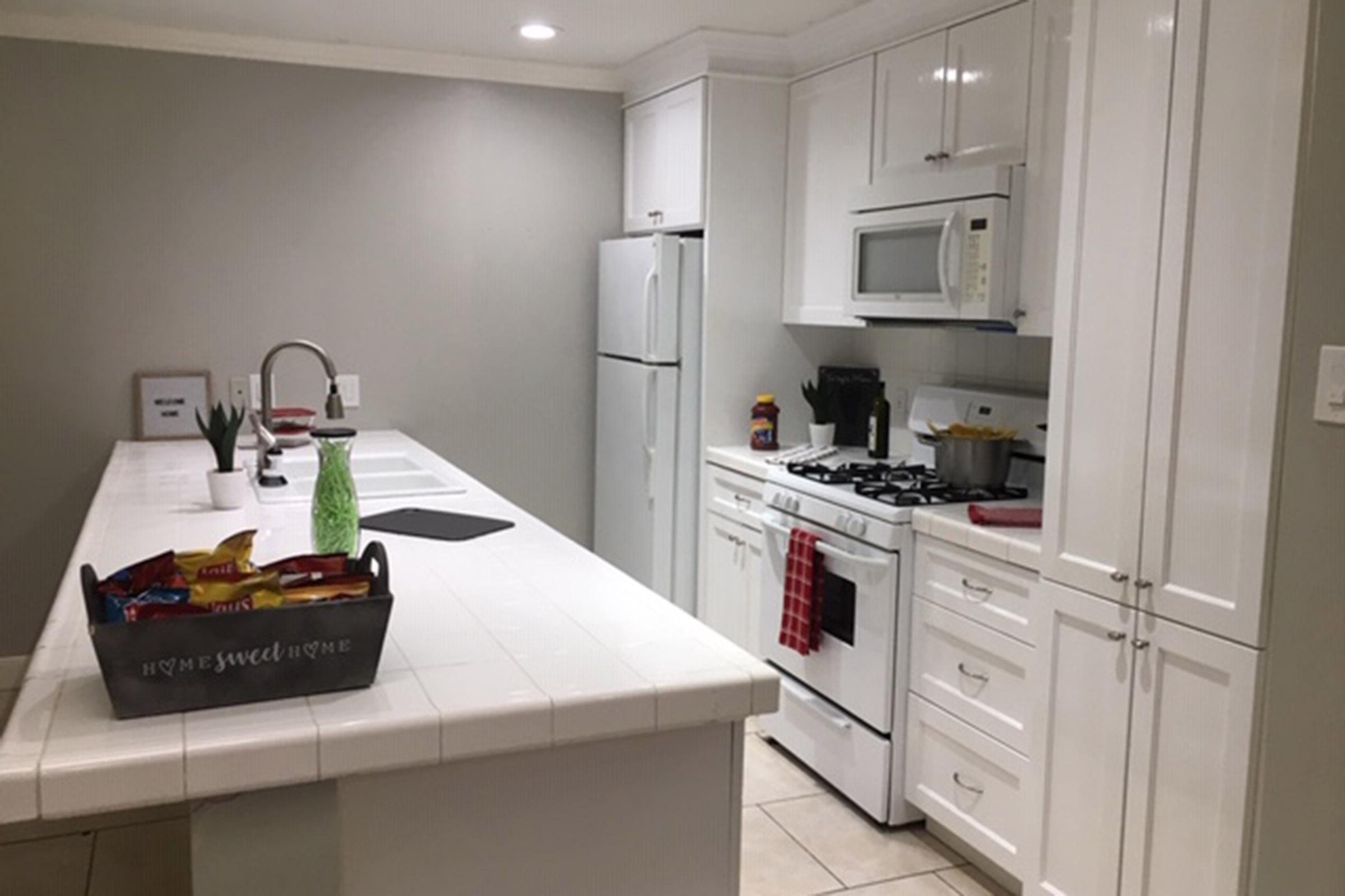 a kitchen with a sink and a microwave