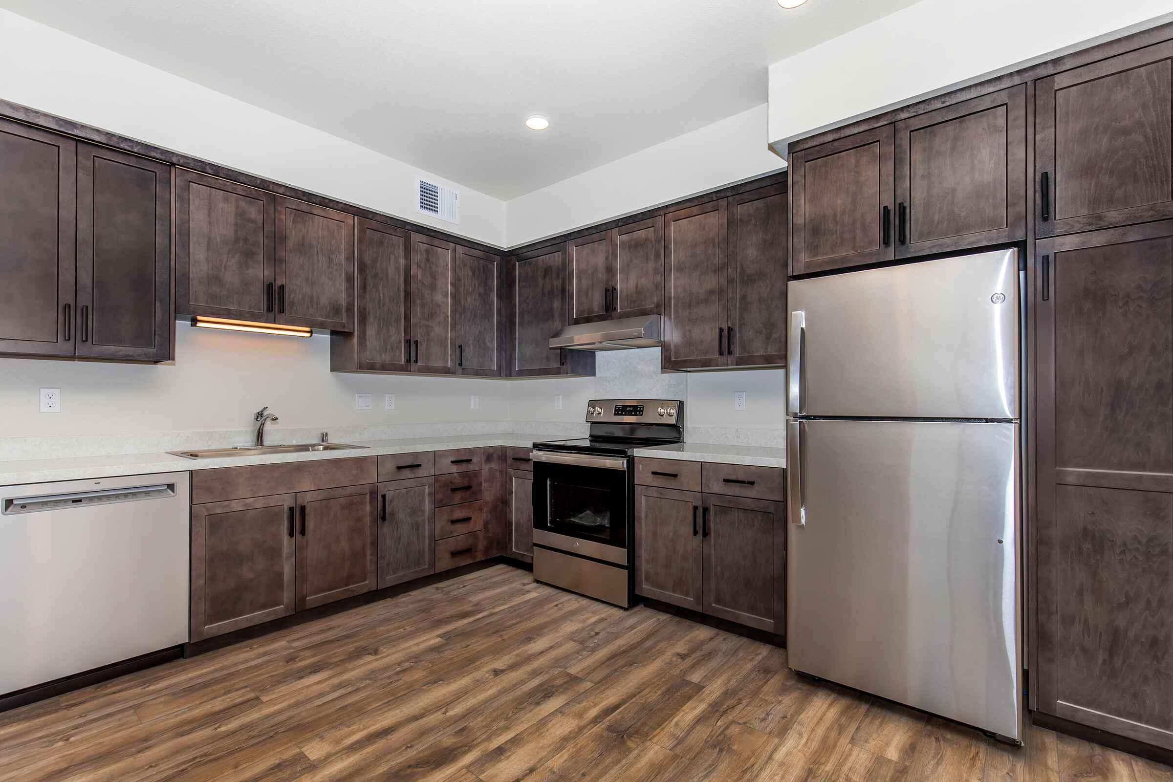 a stainless steel refrigerator in a kitchen