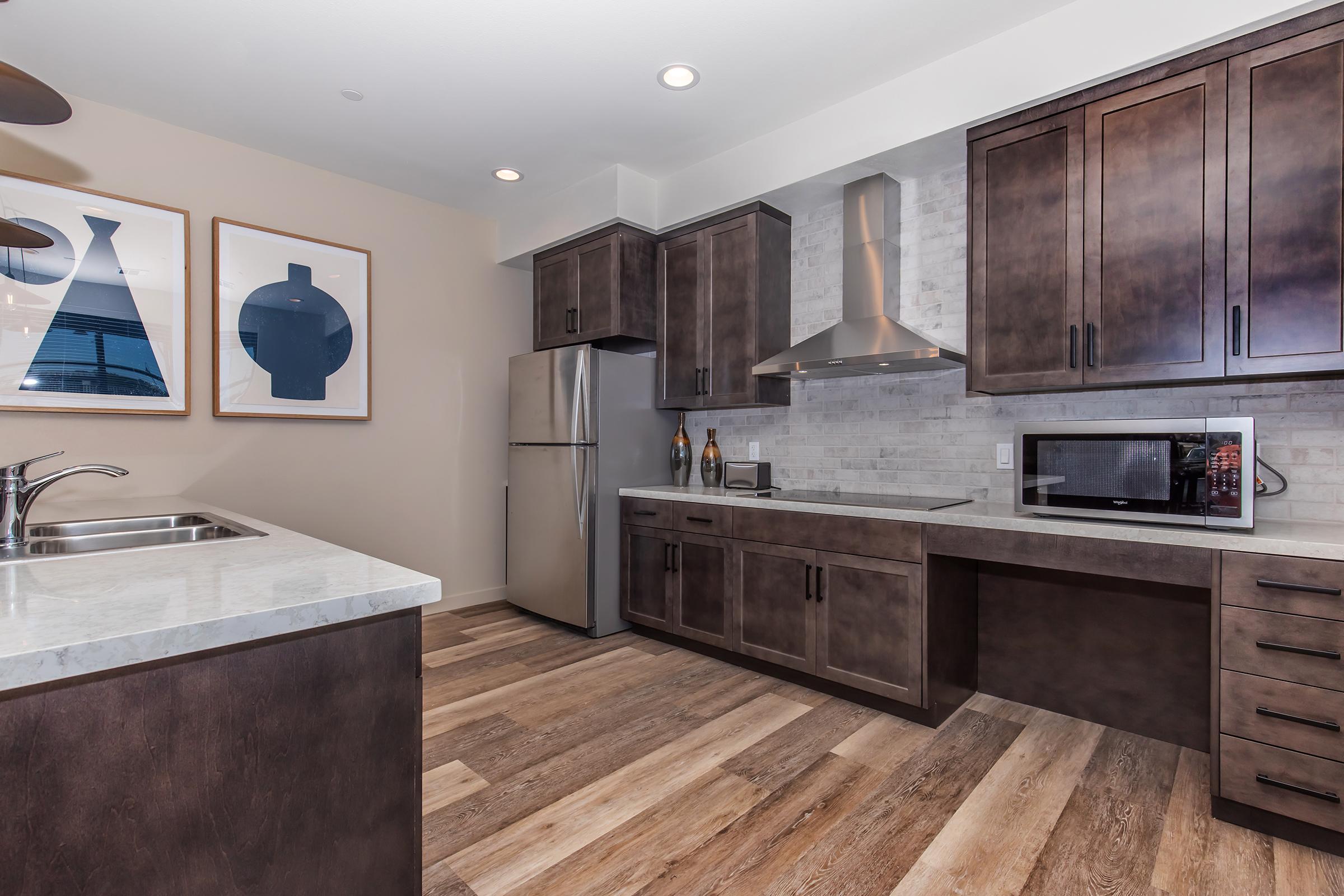 a large kitchen with stainless steel appliances