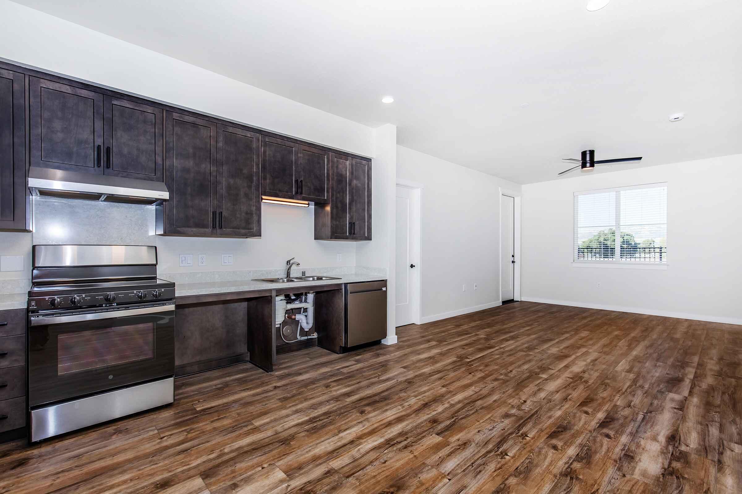 a large kitchen with stainless steel appliances