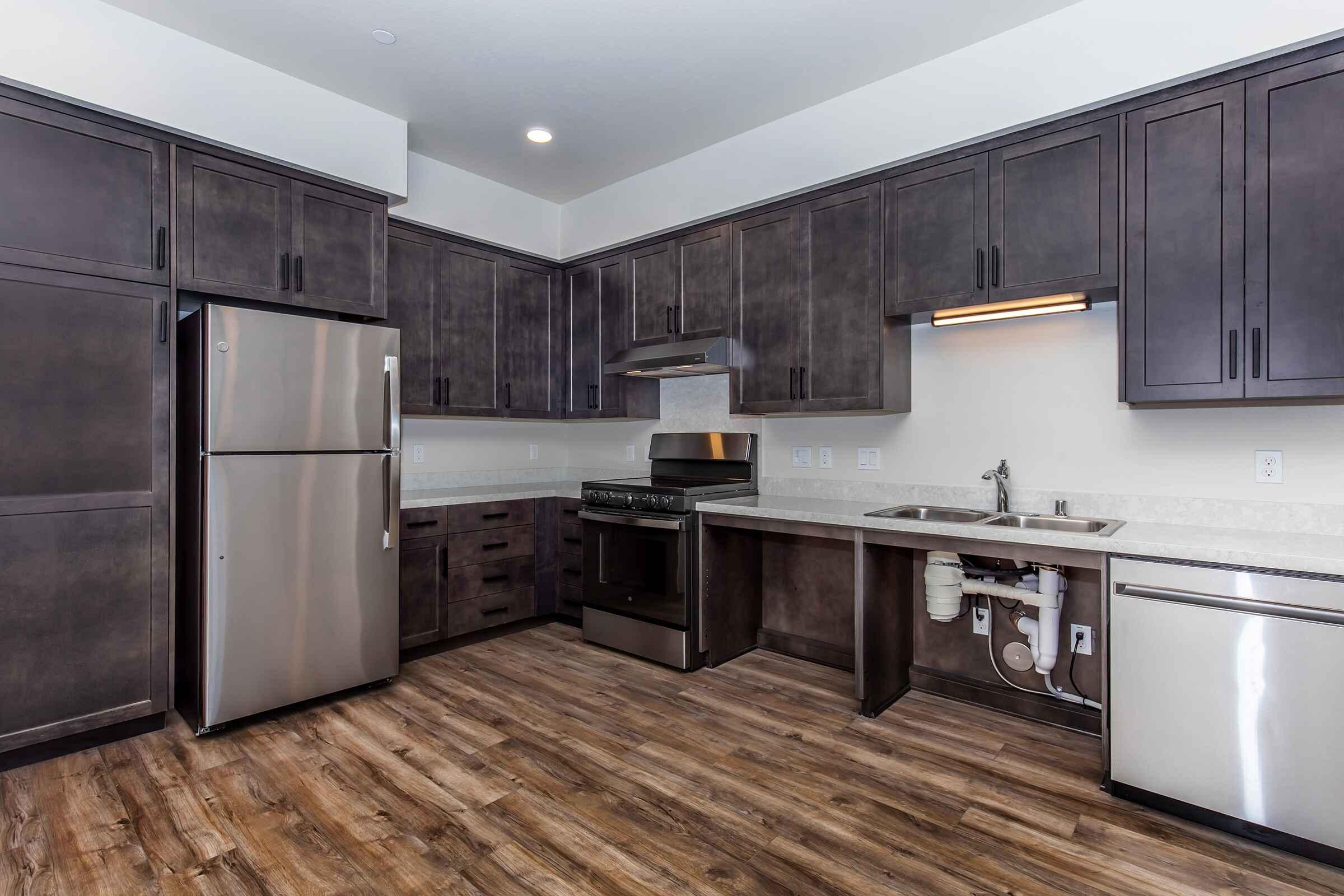 a stainless steel refrigerator in a kitchen