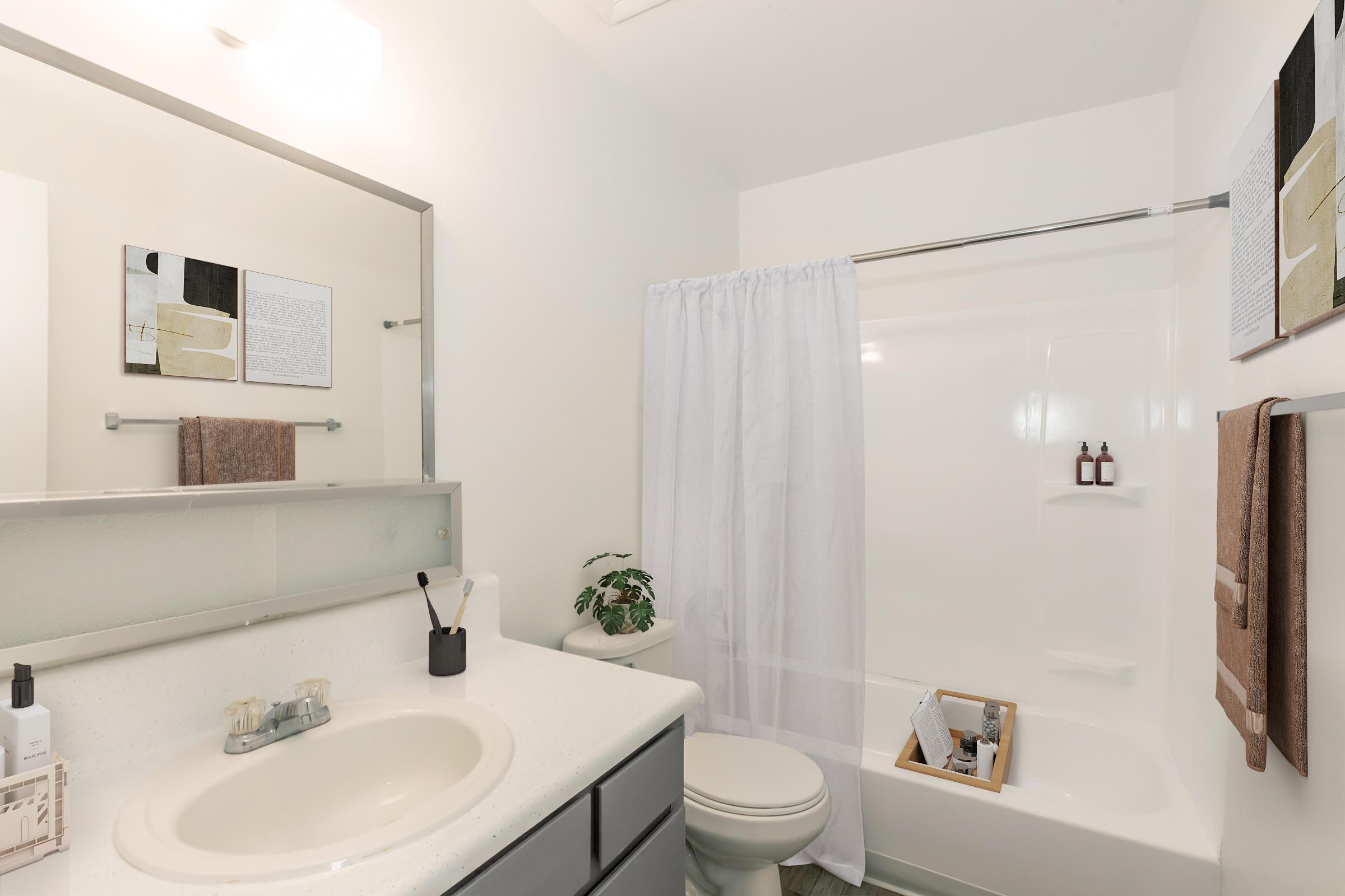 A modern bathroom featuring a white bathtub with a shower curtain, a sink with a countertop, and a mirror. The decor includes neutral-toned towels, a small plant, and toiletries neatly arranged. The walls are painted white, creating a bright, clean atmosphere.