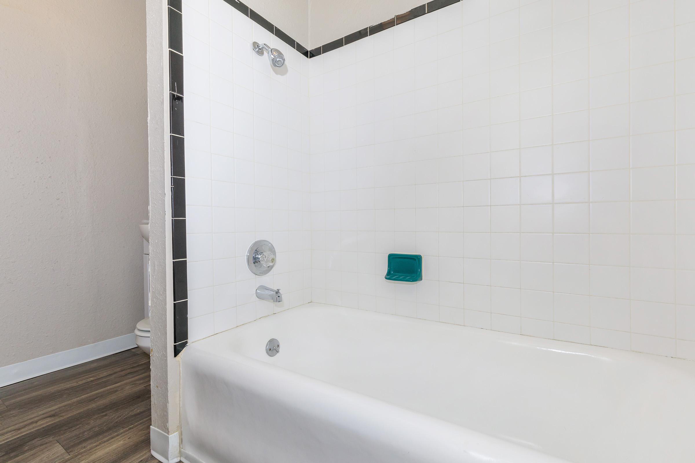 a room with a sink and a bath tub