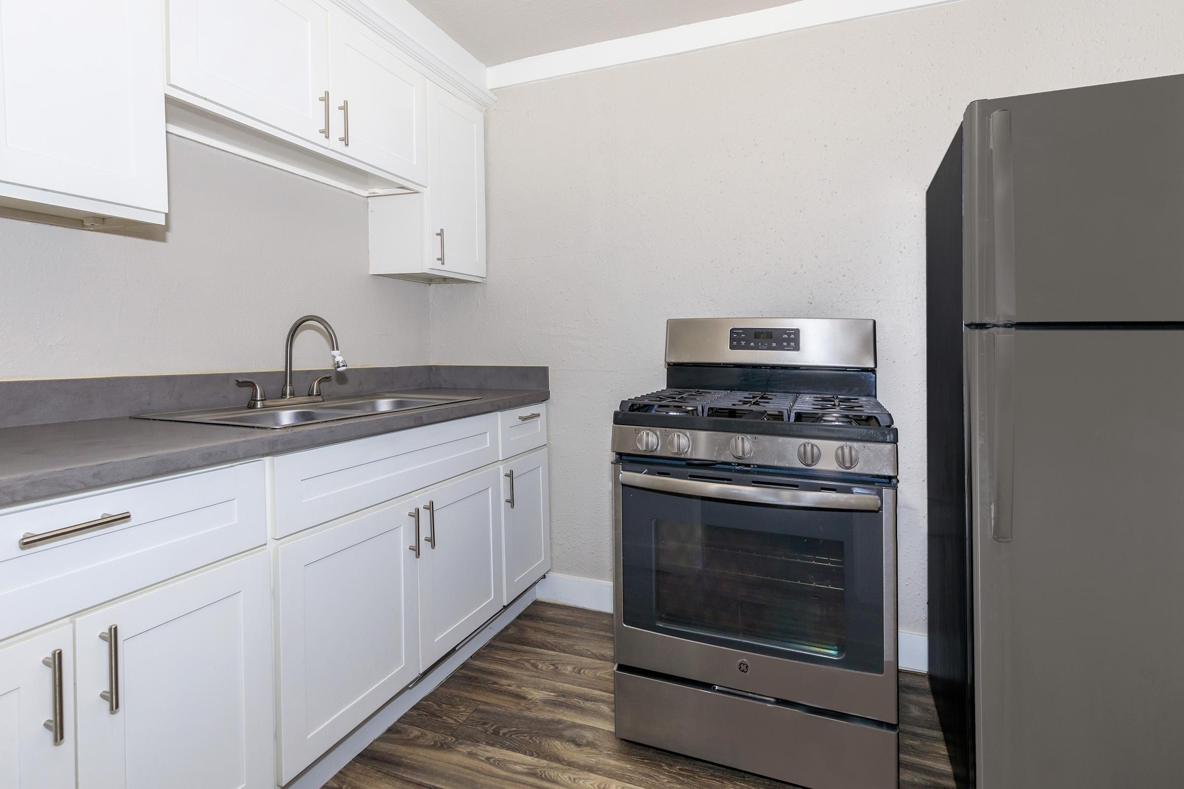 a kitchen with a stove top oven sitting inside of a refrigerator