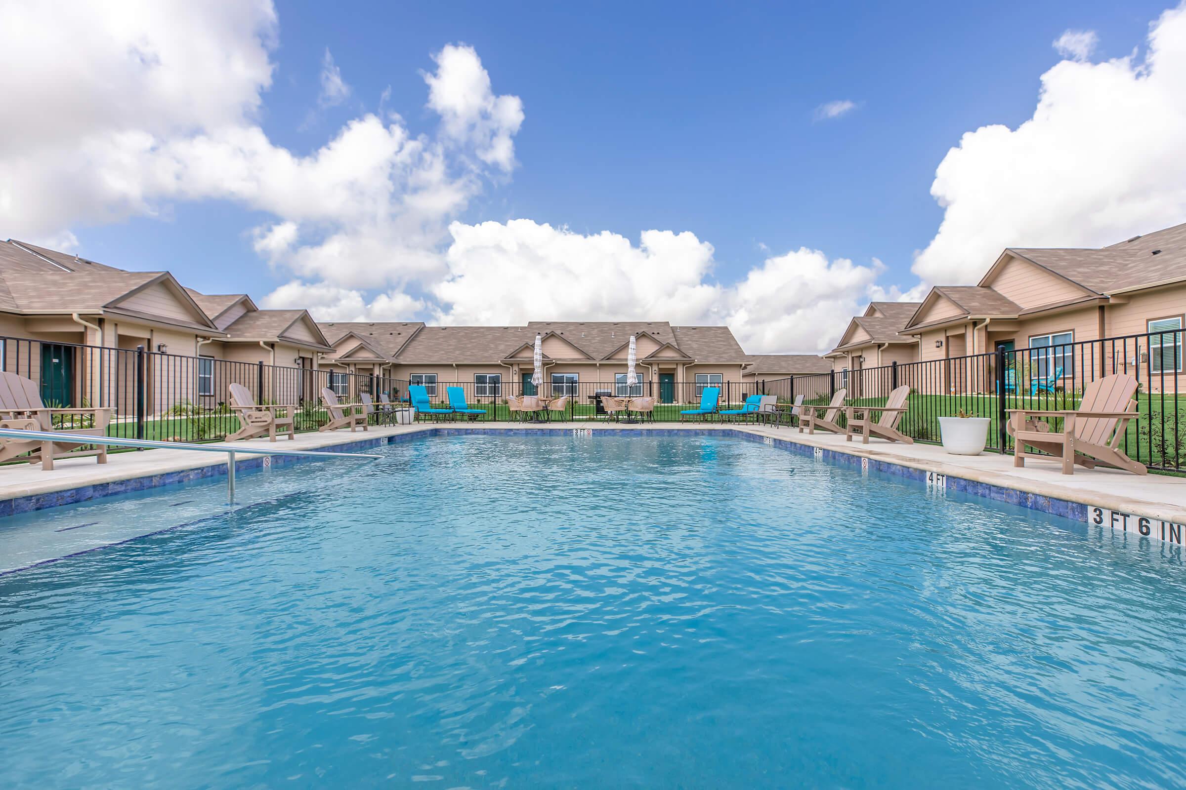 a house with a large pool of water