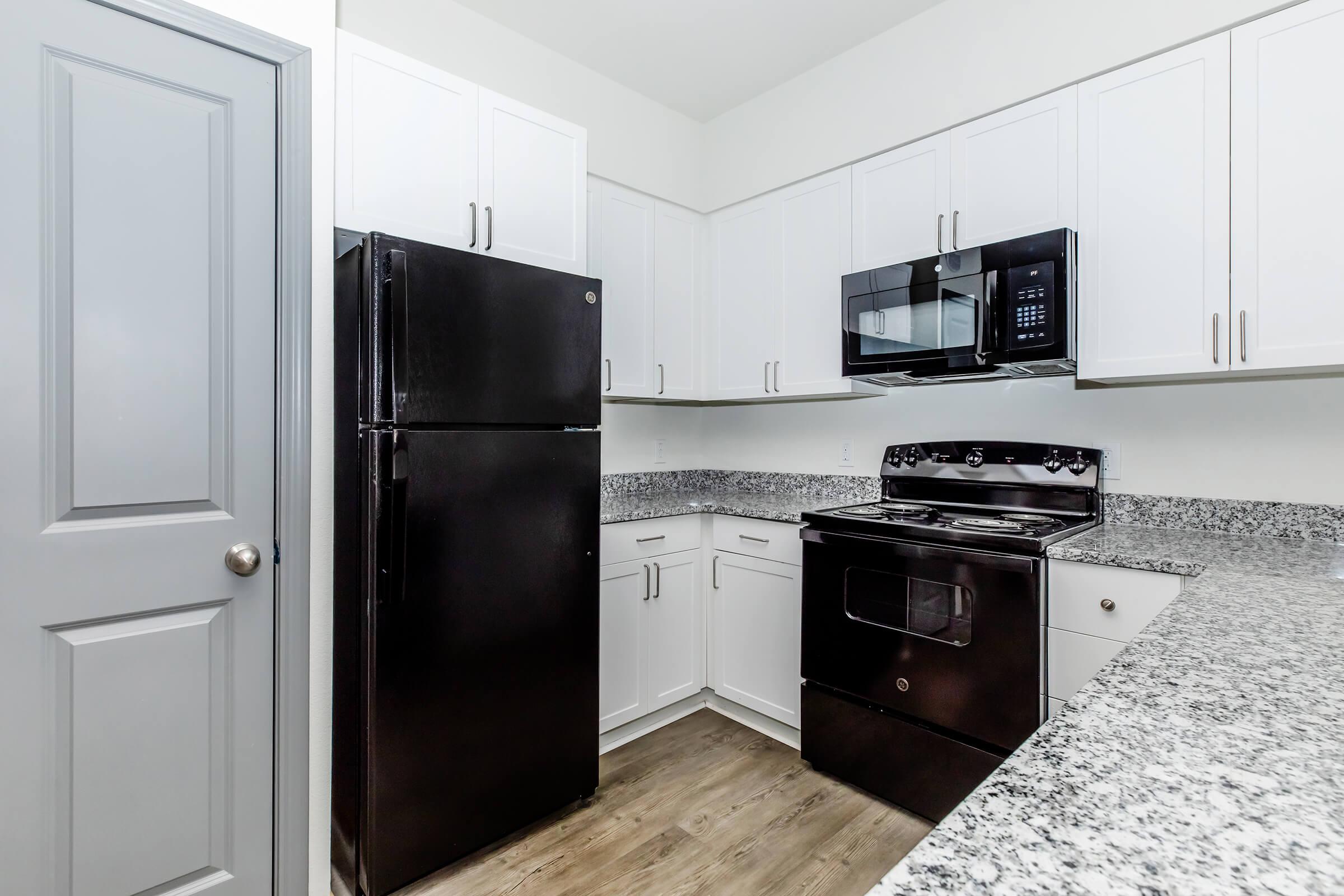 a stainless steel refrigerator in a kitchen