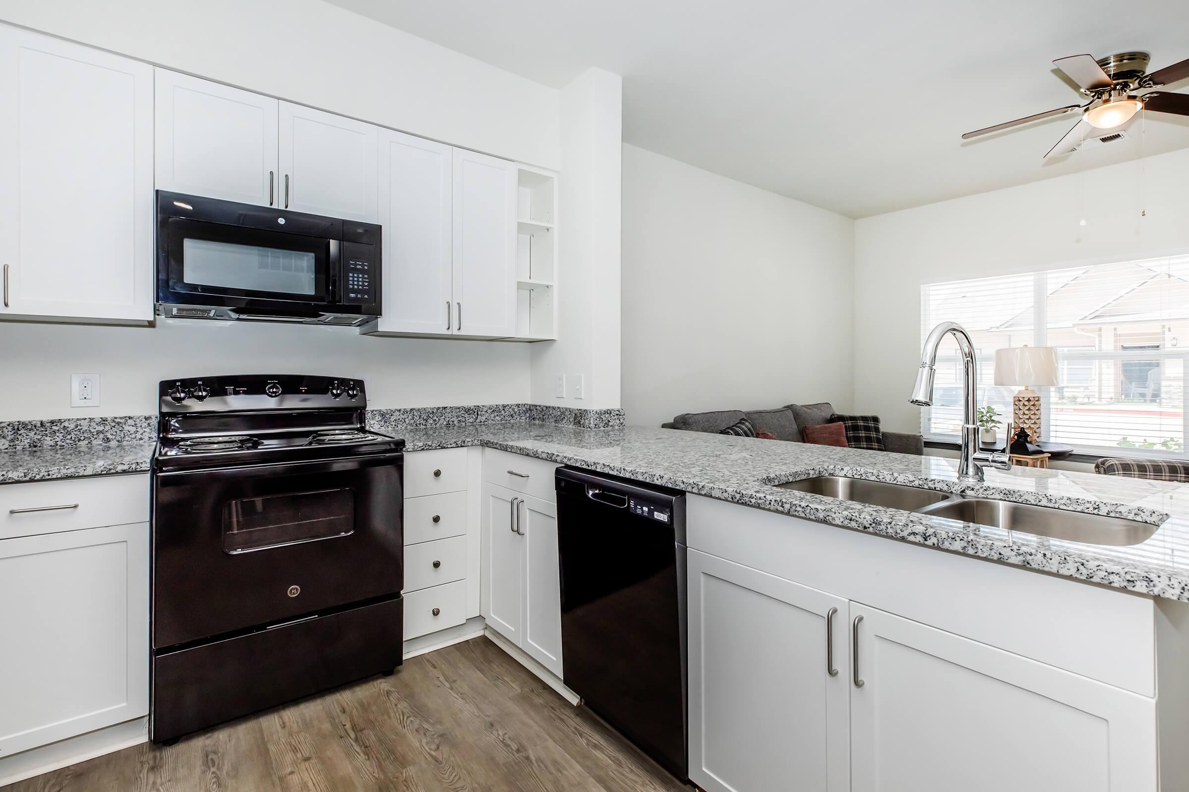 a kitchen with a sink and a stove