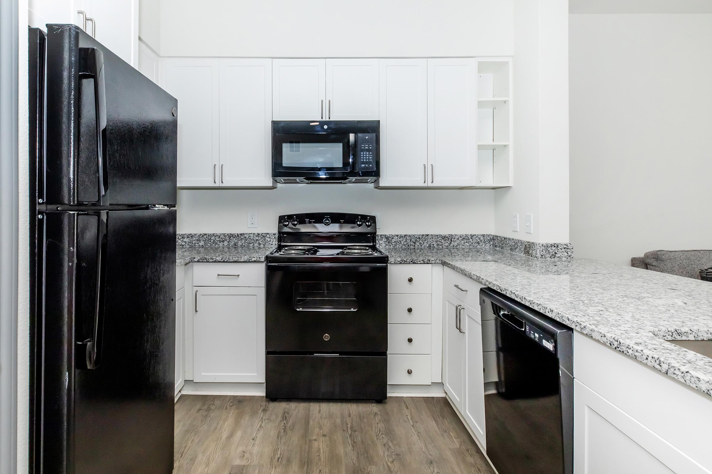 a kitchen with a stove top oven sitting inside of a refrigerator