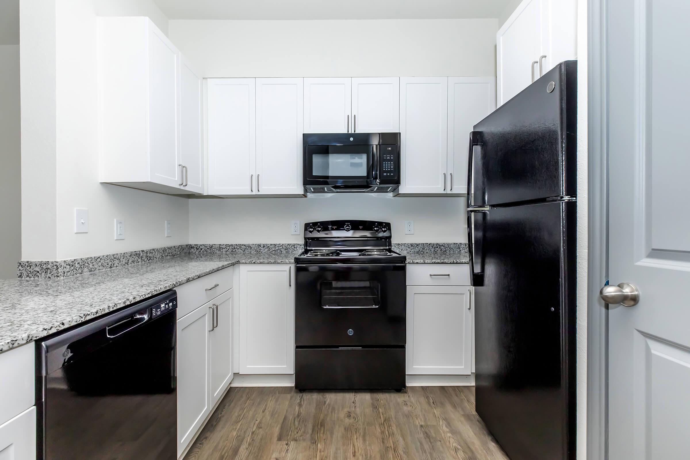 a modern kitchen with stainless steel appliances