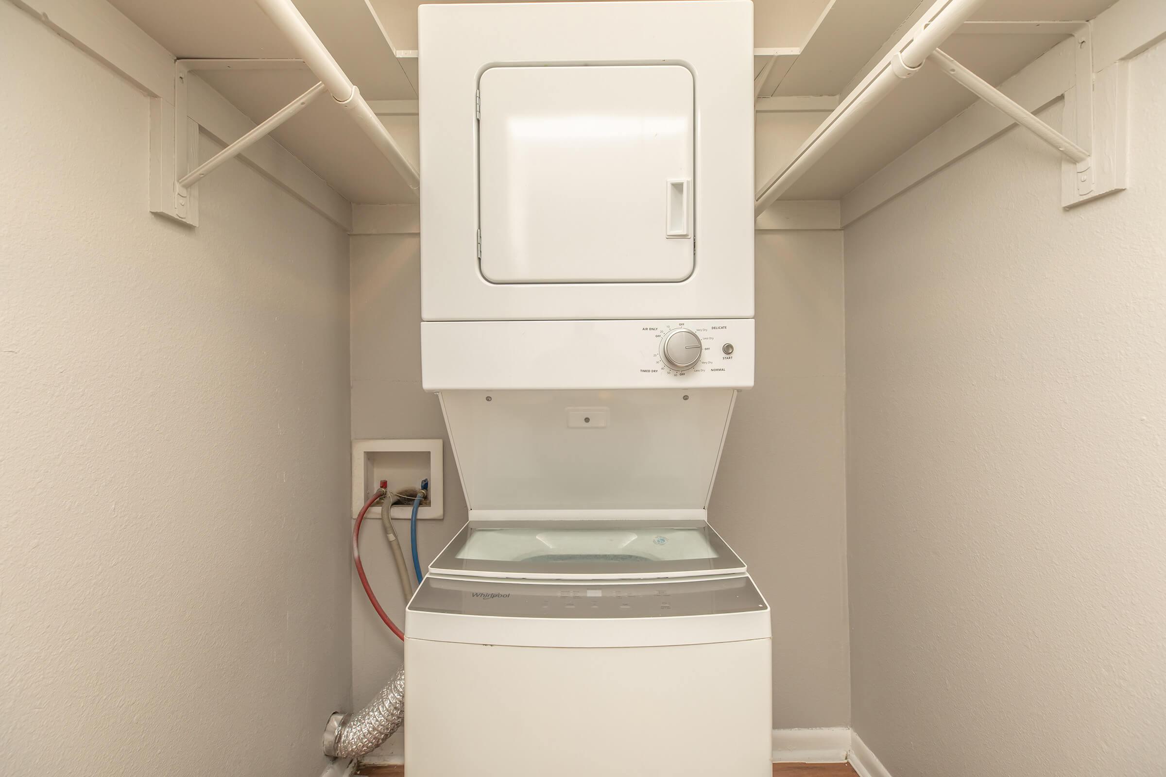 a refrigerator freezer sitting in a room