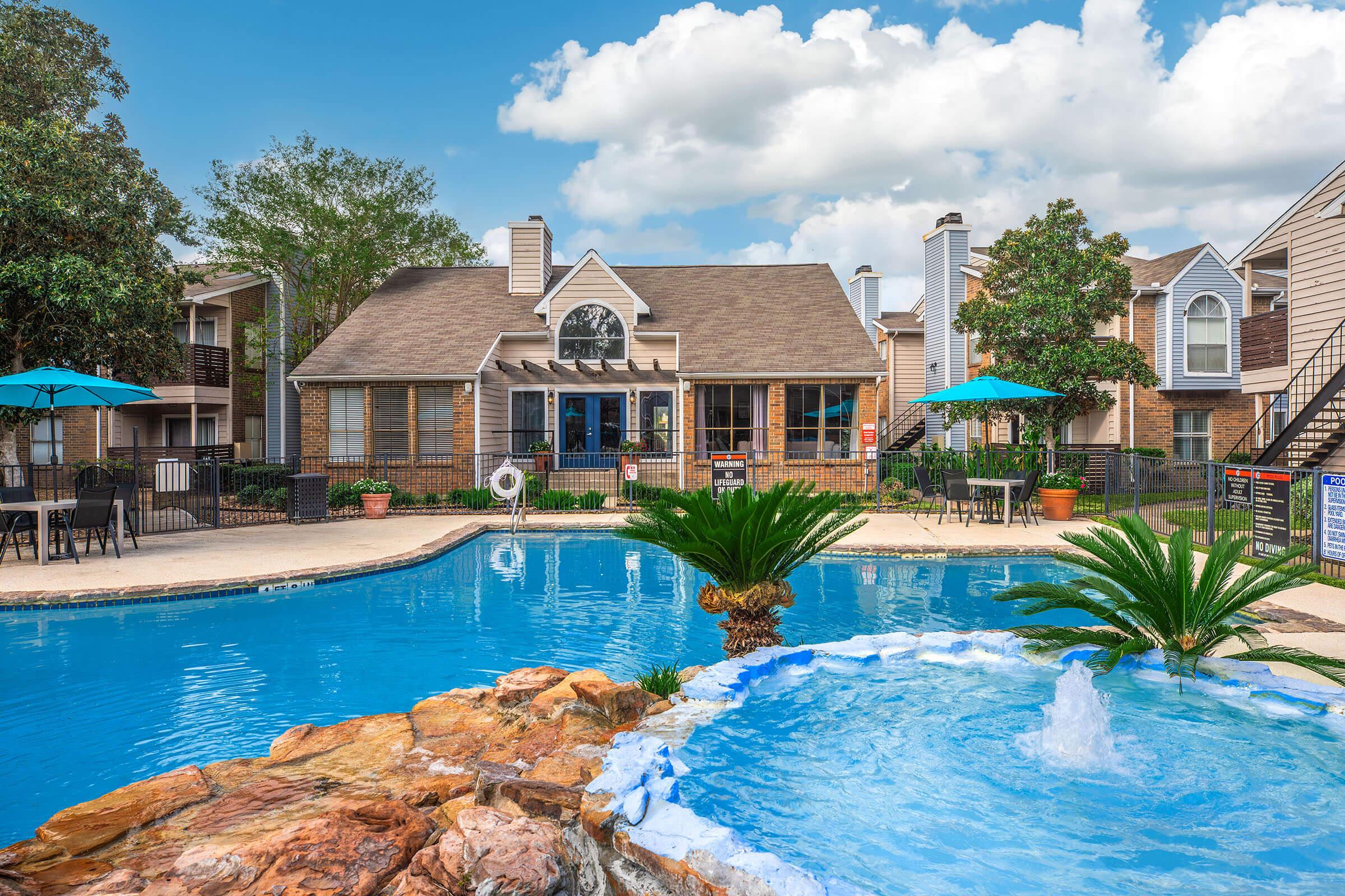 a house with a large pool of water