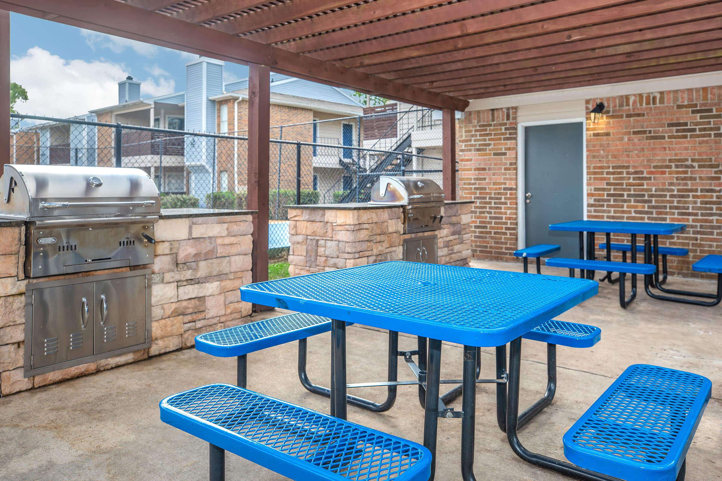 a kitchen with a blue chair