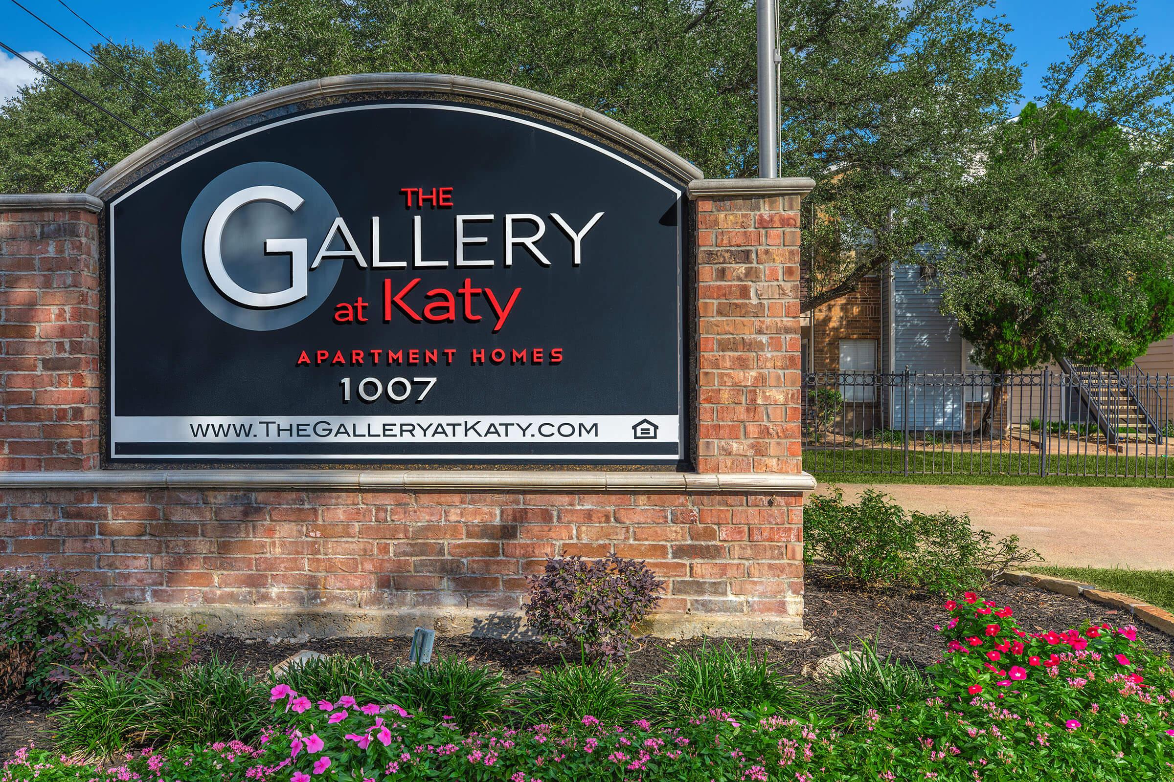 a sign in front of a brick building