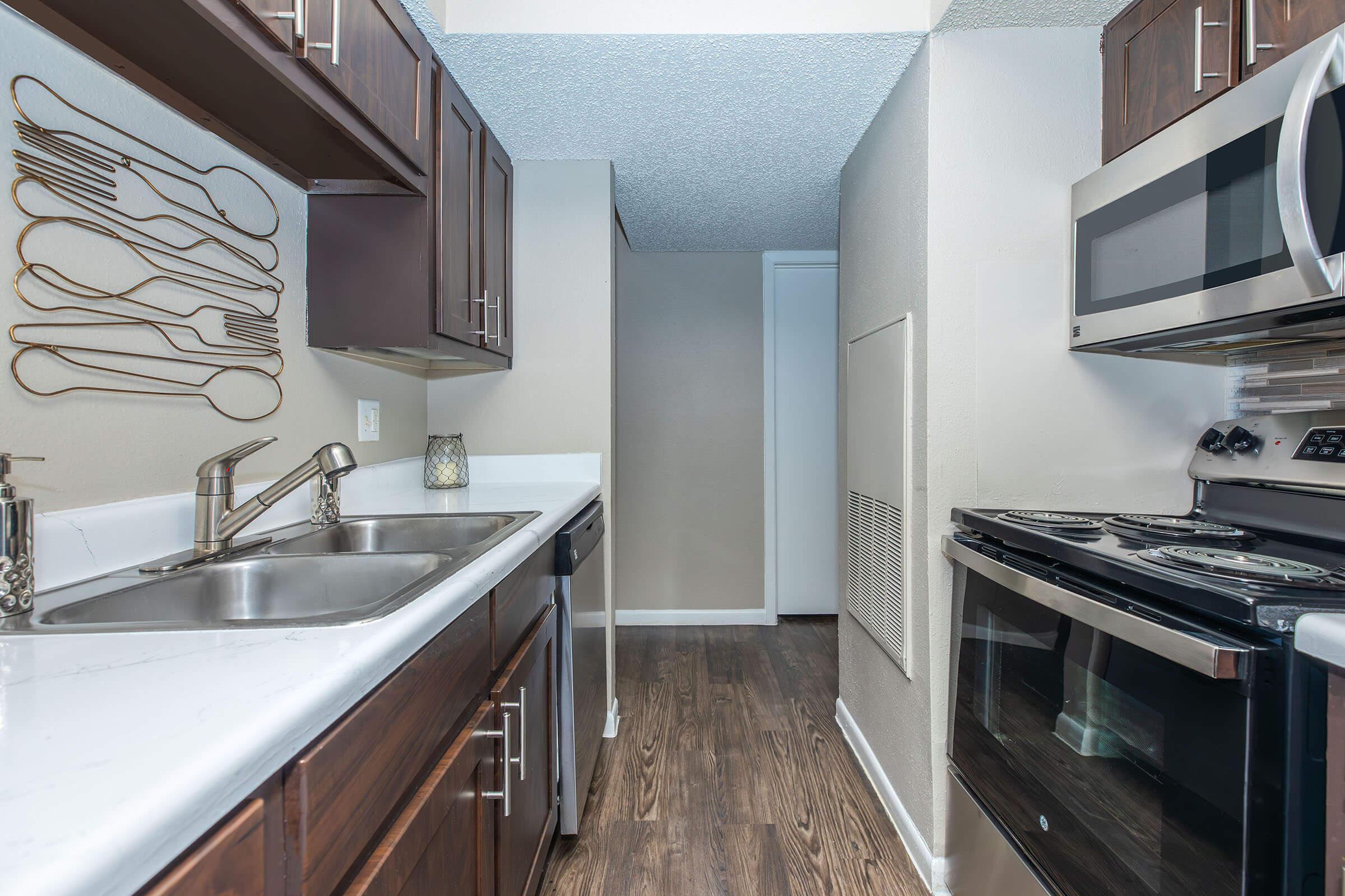 a kitchen with a stove and a sink