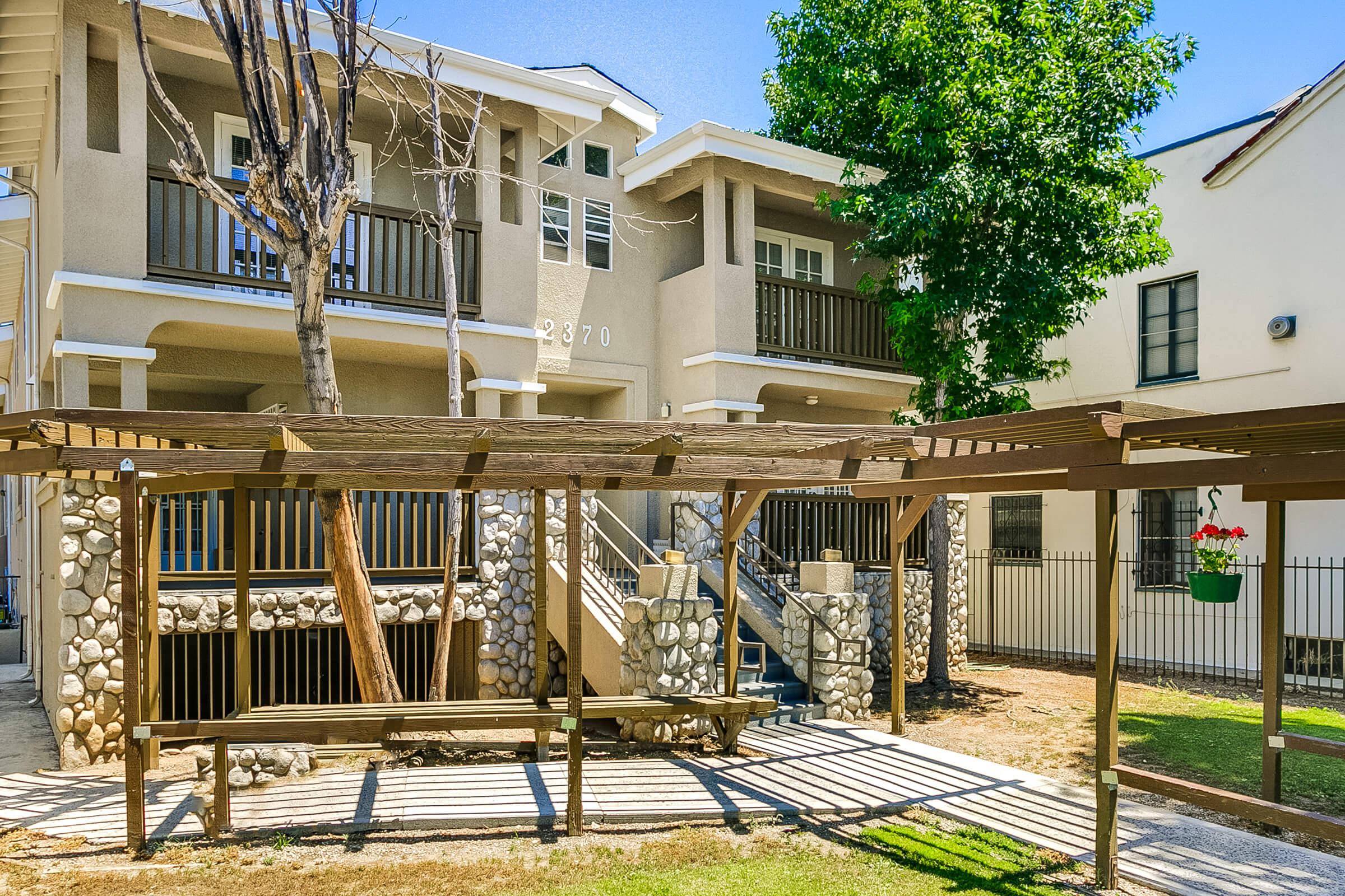 a building with a wooden fence