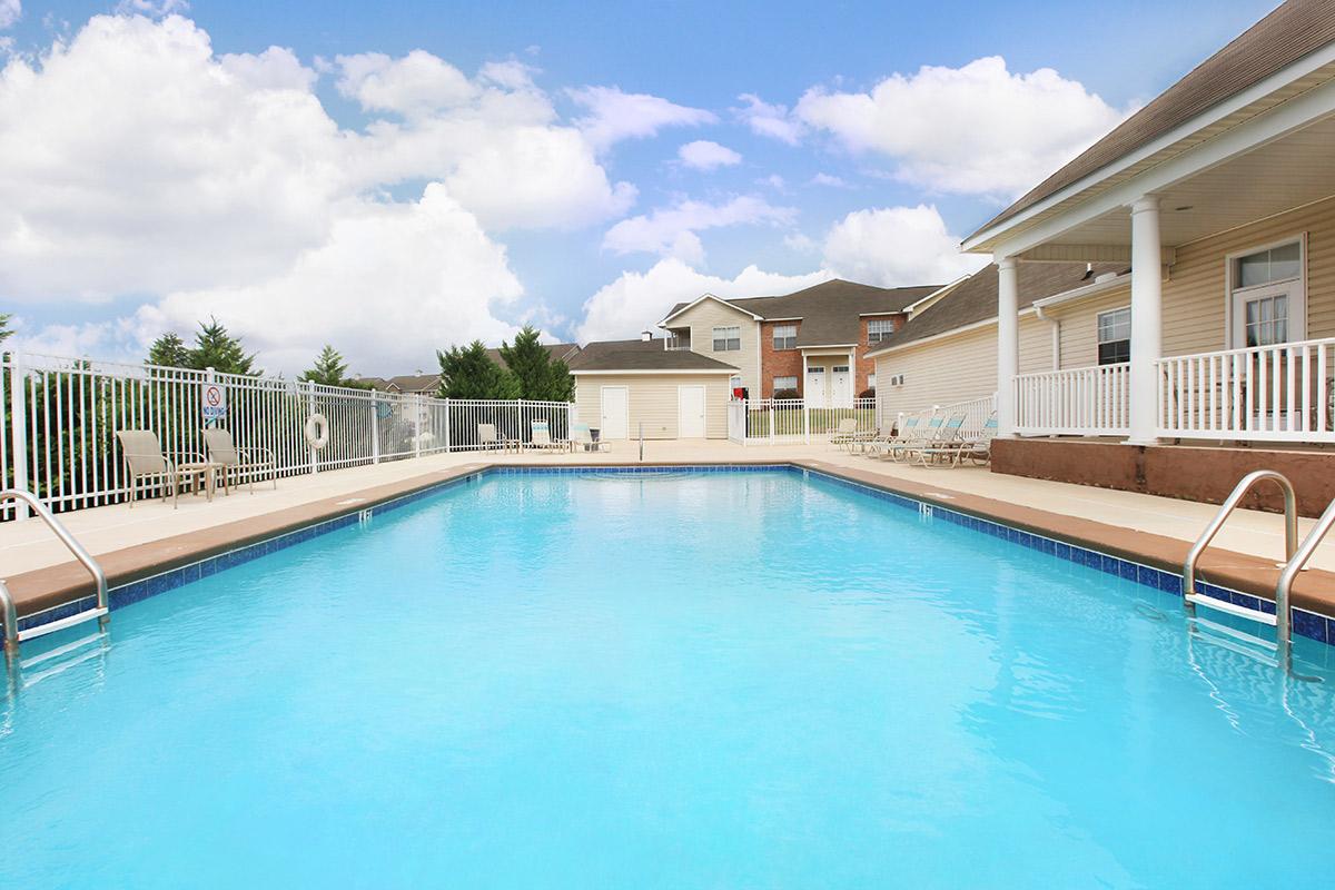 a pool next to a body of water