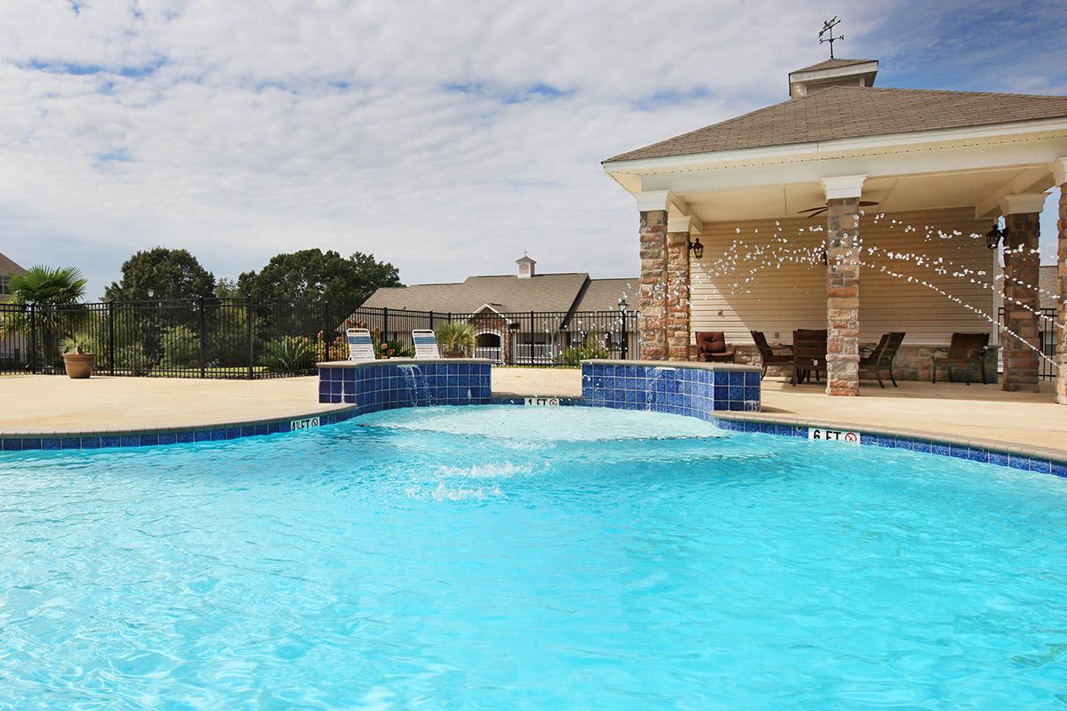 a blue and swimming in a pool of water