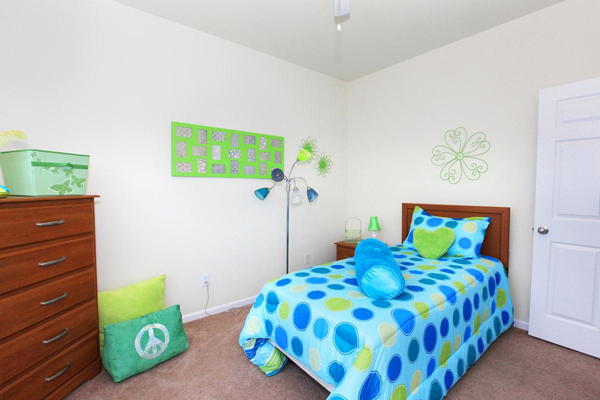 a bedroom with a green door in a room