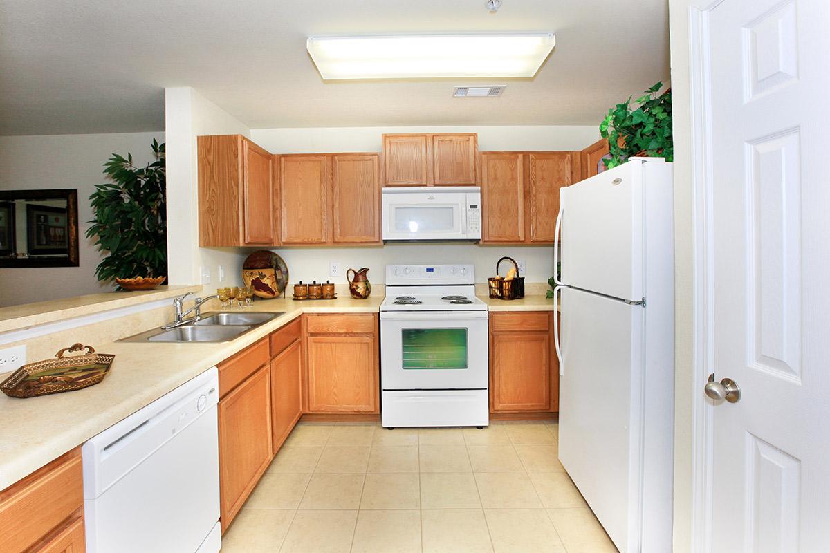 a kitchen with a sink and a microwave